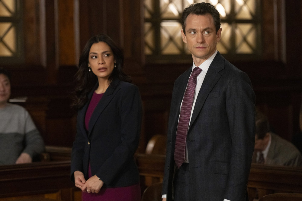 Law & Order - Season 23 | Tell-Tale TV Law & Order Season 23 Episode 11 - Odelya Halevi as ADA Samantha Maroun stands to the right of Hugh Dancy as ADA Nolan Price in court.