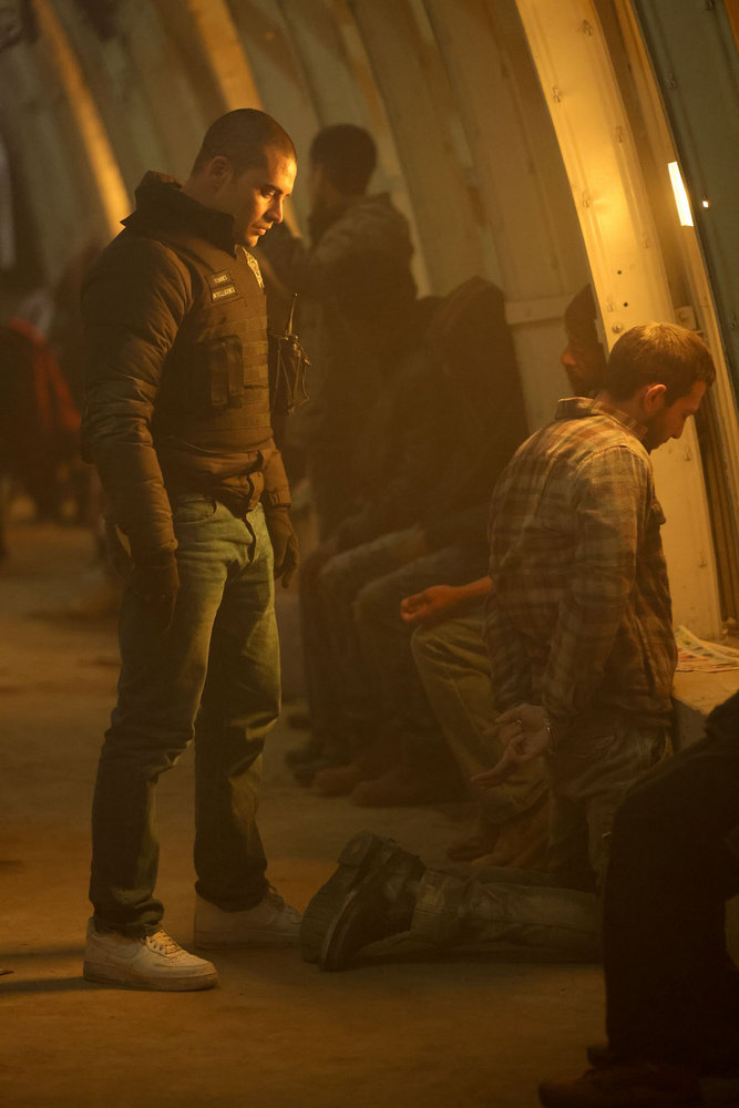 Chicago P.D. Season 11 Episode 13 - Benjamin Levy Aguilar as Dante Torres stands behind a suspect who is on his knees facing the wall with his hands behind his back. Preview — Chicago P.D. Season 11 Episode 13: Will Voight Survive the Season Finale? Chicago P.D. Season 11 Episode 13 - Benjamin Levy Aguilar as Dante Torres stands behind a suspect who is on his knees facing the wall with his hands behind his back.