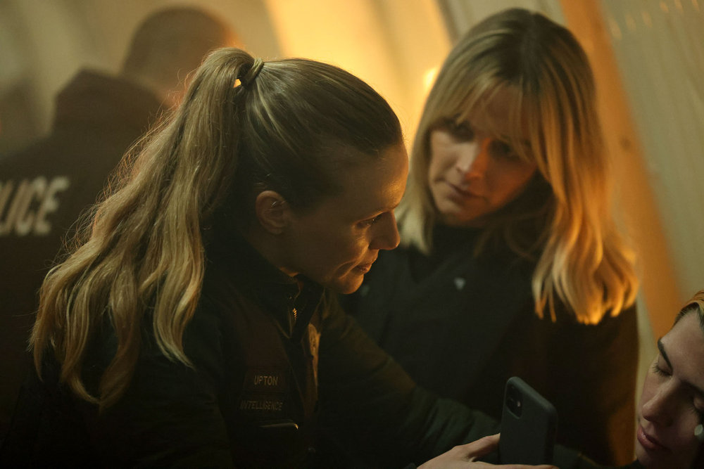 Chicago P.D. - Season 11 | Tell-Tale TV Chicago P.D. Season 11 Episode 13 - Tracy Spiridakos as Hailey Upton stands with Bojana Novakovic as Josephine Petrovic talking with a possible witness.