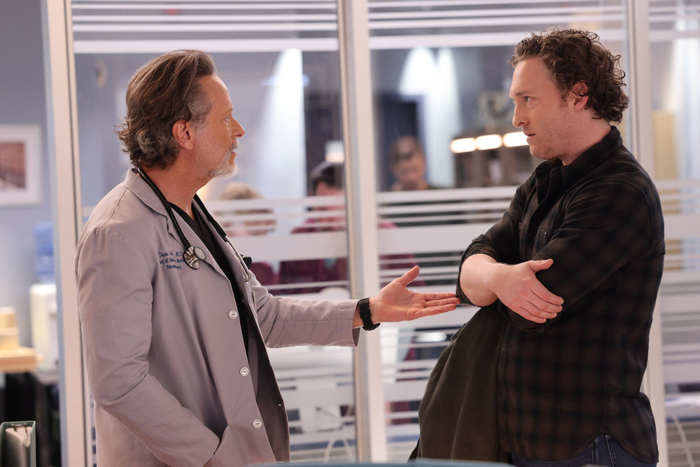 Chicago Med Season 9 Episode 13 - Steven Webber as Dr. Dean Archer talks with Luigi Sottile as Sean Archer.