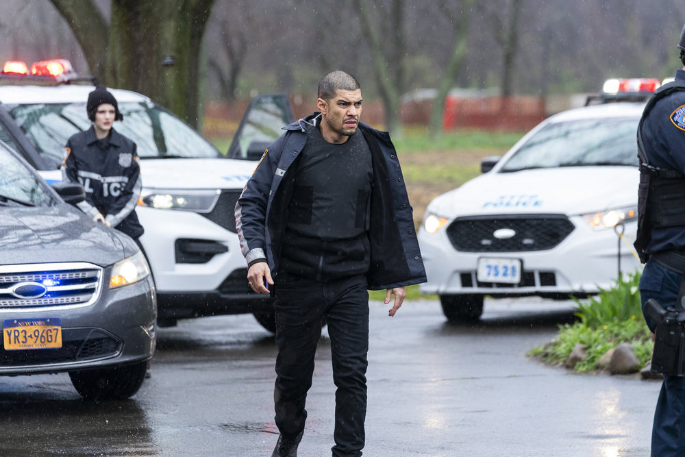 Law & Order: Organized Crime - Season 4 | Tell-Tale TV Law & Order: Organized Crime Season 4 Episode 11 - Rick Gonzalez as Det. Bobby Reyes approaches the main house of the farm with other cop cars and Ainsley Seiger as Jet Slootmaekers behind him.