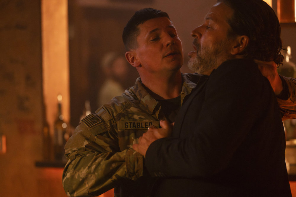 Law & Order: Organized Crime - Season 4 | Tell-Tale TV Law & Order: Organized Crime Season 4 Episode 12 - Michael Trotter as Joseph Stabler Jr. in his military uniform holds onto Christopher Maleki as Abdul Azim Ghani by the back of the neck.