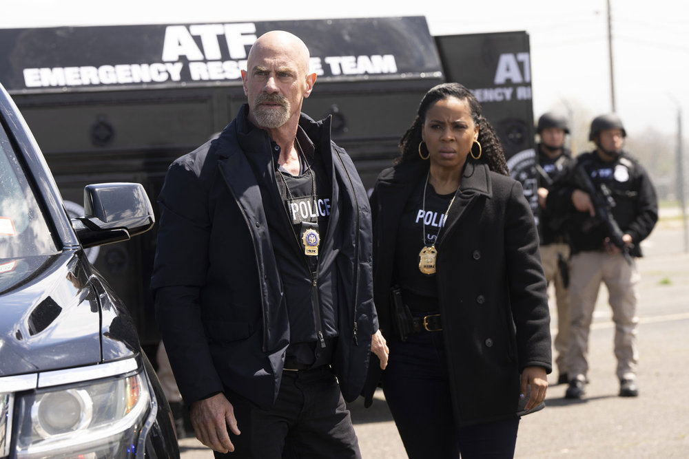 Law & Order: Organized Crime - Season 4 | Tell-Tale TV Law & Order: Organized Crime Season 4 Episode 13 - Christopher Meloni as Det. Elliot Stabler stands in front of Danielle Moné Truitt as Sergeant Ayanna Bell. Both are in full gear with ATF on lookout.