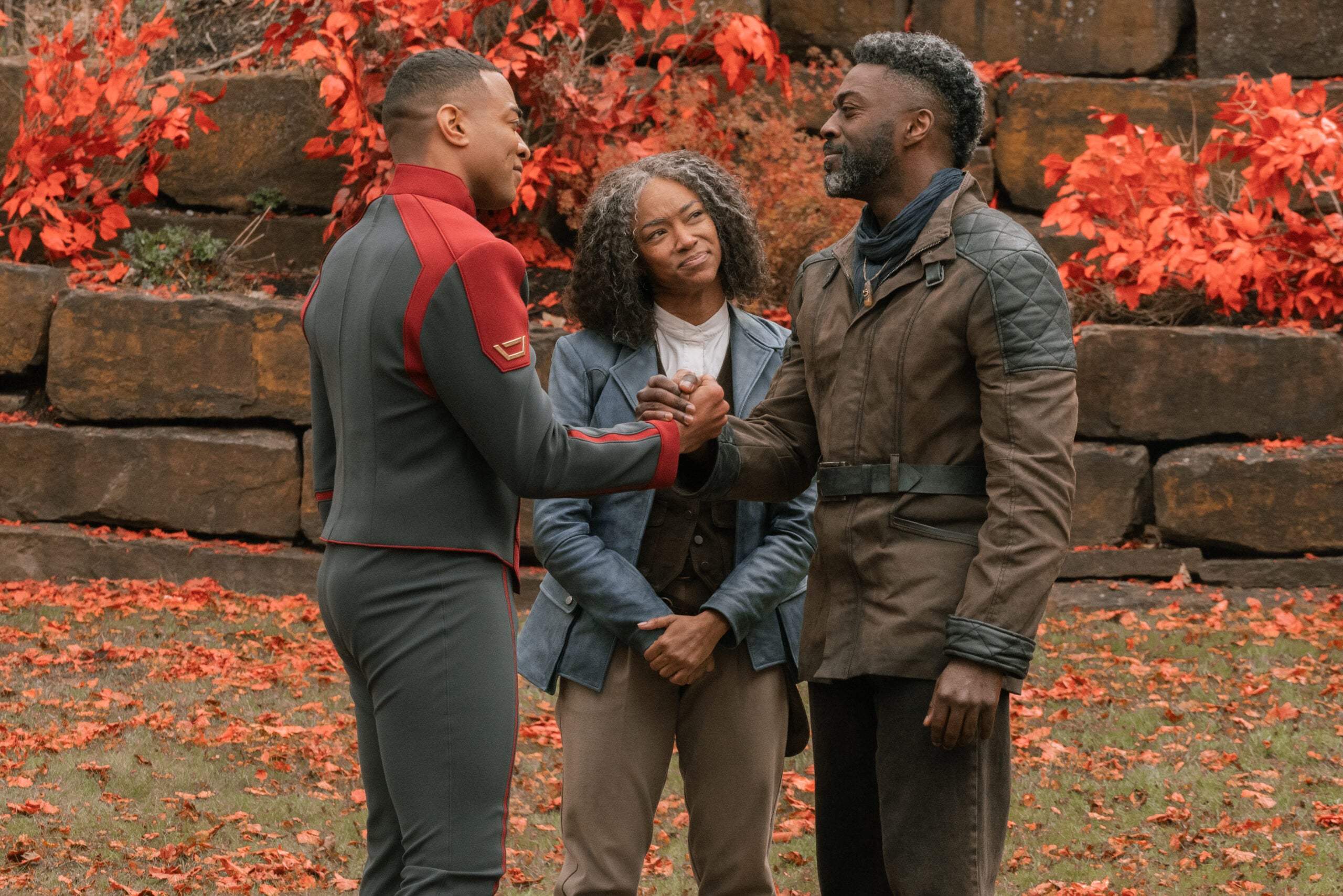 Captain Leto, Admiral Burnham and Book embrace while standing in front of their home on Sanctuary Four on Star Trek: Discovery Season 5 Episode 10, "Life, Itself."