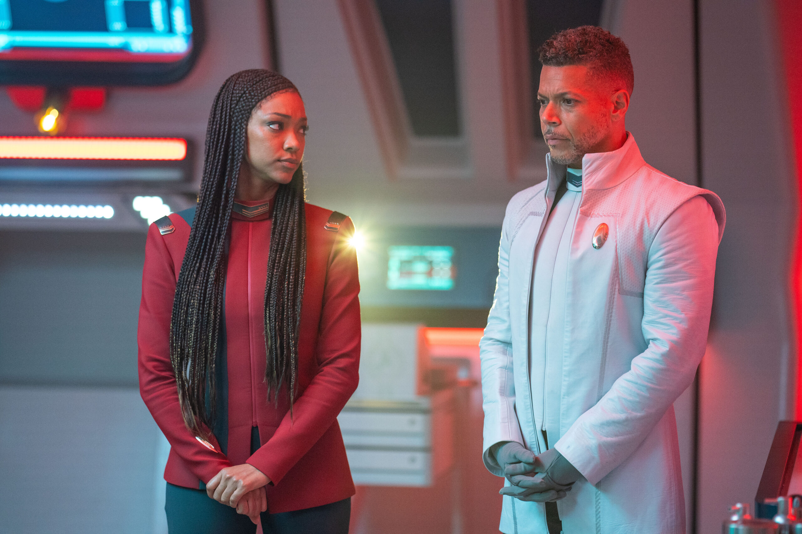 Star Trek: Discovery Season 5 Episode 7 Erigah | Tell-Tale TV Captain Burnham and Dr. Culber stand in the sick bay of the U.S.S. Discovery on Star Trek: Discovery Season 5 Episode 7, "Erigah."