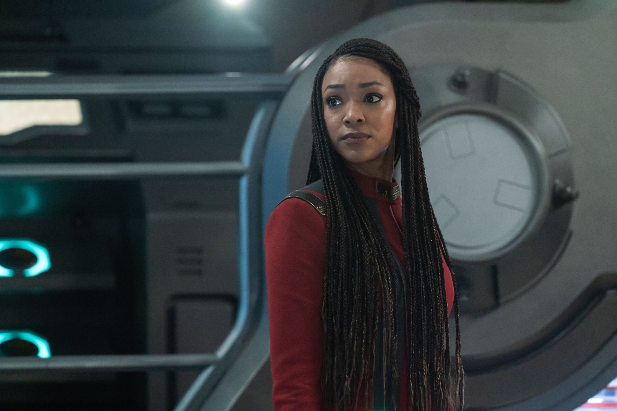 Star Trek: Discovery Season 5 Episode 9 Lagrange Point | Tell-Tale TV Captain Burnham wears her red Starfleet uniform while standing on the U.S.S. Discovery on Star Trek: Discovery Season 5 Episode 9, "Lagrange Point."