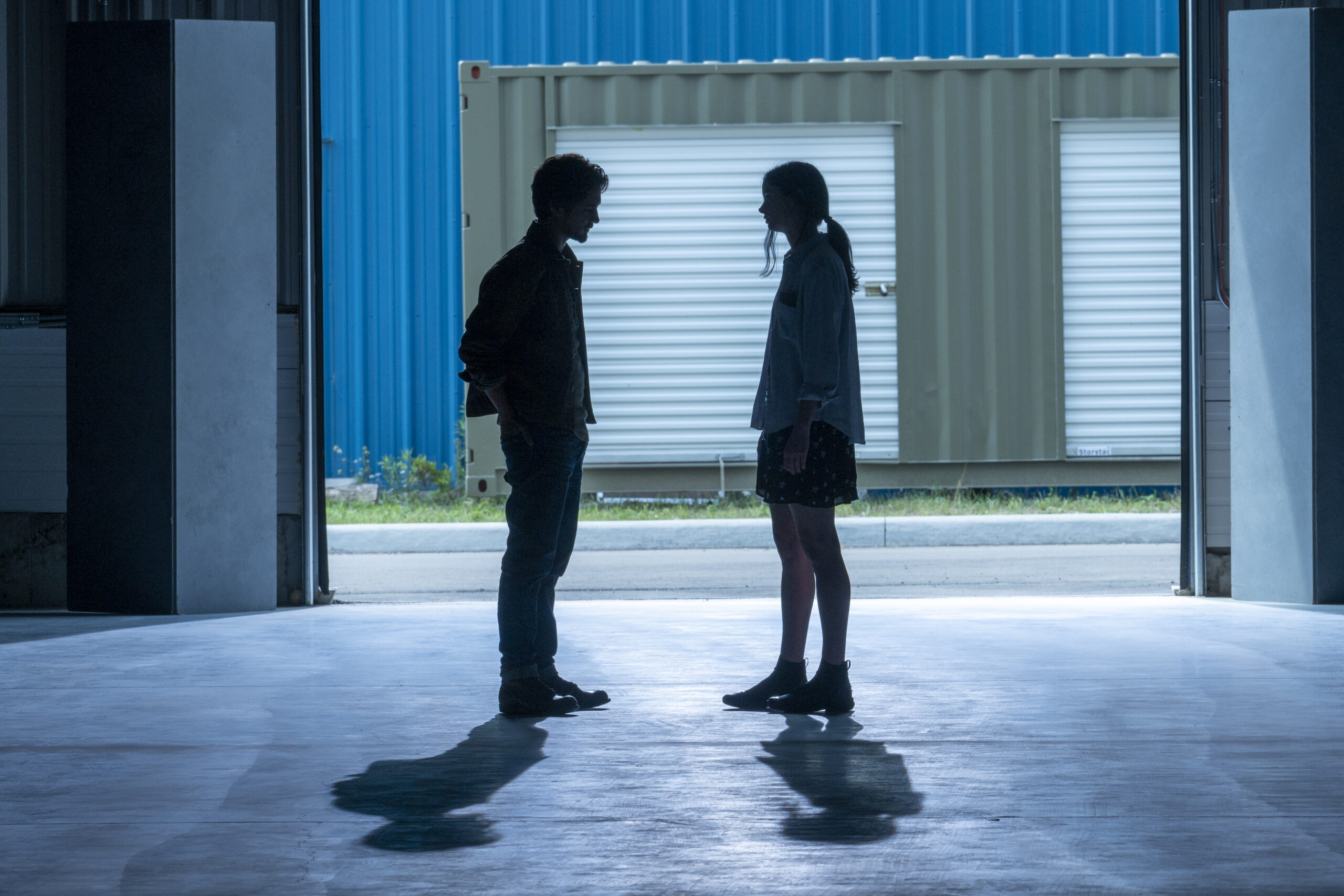 Still from Orphan Black: Echoes Season 1 Episode 2 of Avan Jogia as Jack and Krysten Ritter as Lucy standing in silhouette from left to right. Orphan Black: Echoes Season 1 Episode 2 Review: Jules Still from Orphan Black: Echoes Season 1 Episode 2 of Avan Jogia as Jack and Krysten Ritter as Lucy standing in silhouette from left to right.