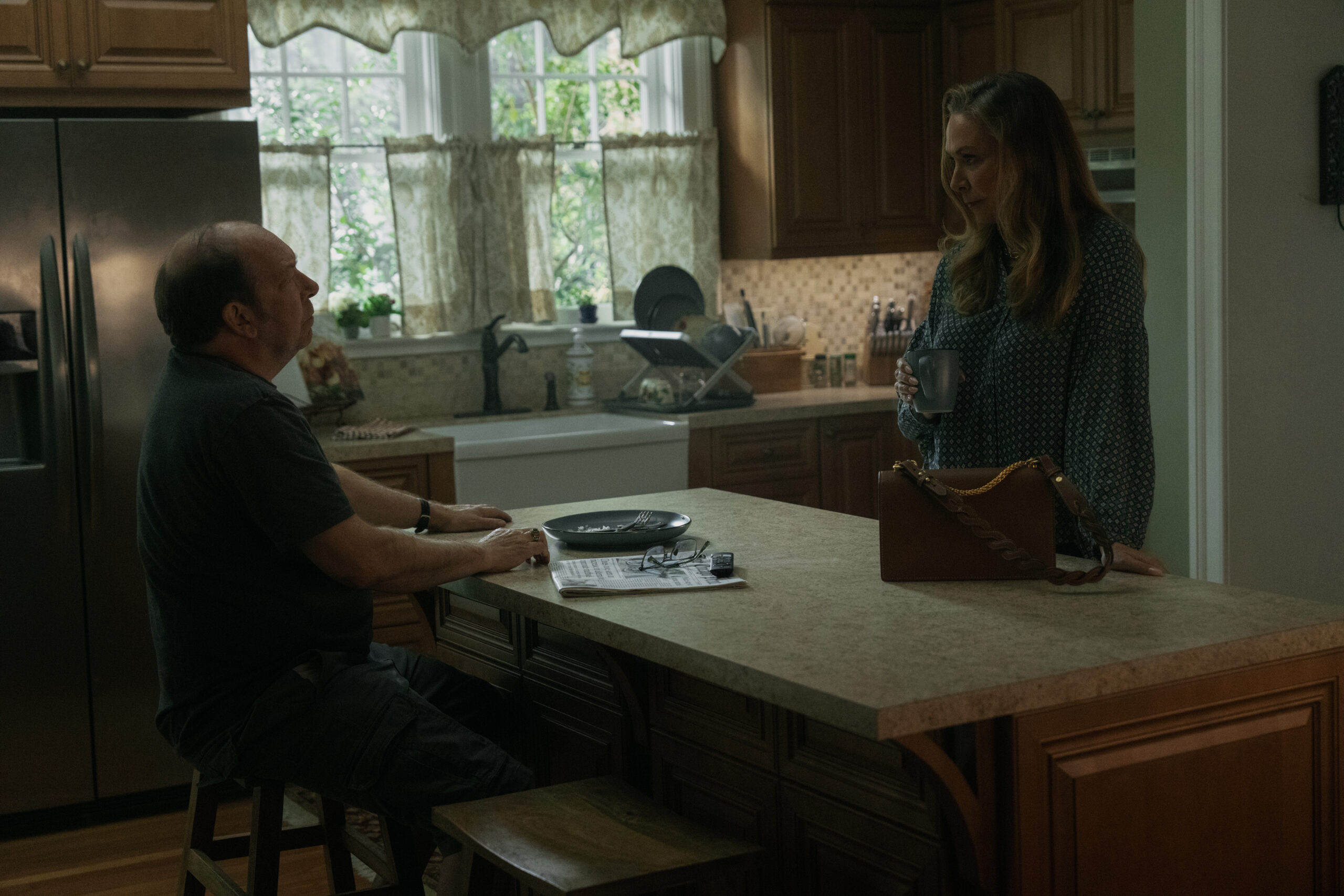 Elizabeth Marvel and Bill Camp talking to each other in the kitchen.