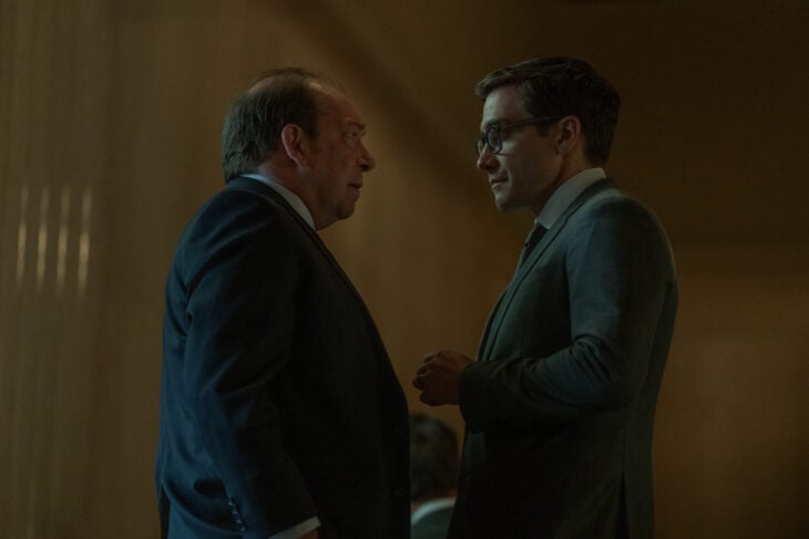 Bill Camp and Jake Gyllenhaal talking, both in suits.