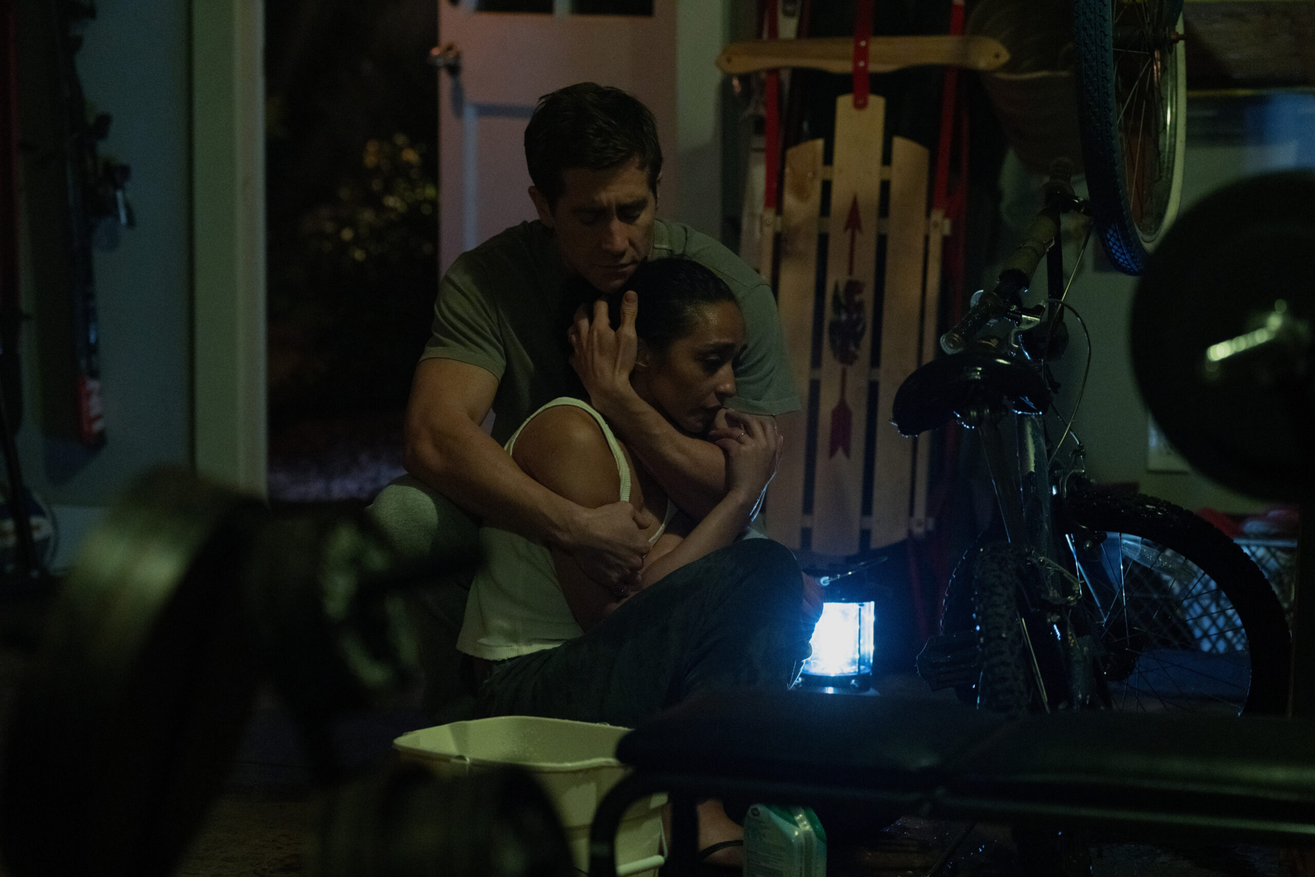 Jake Gyllenhaal holding Ruth Negga.