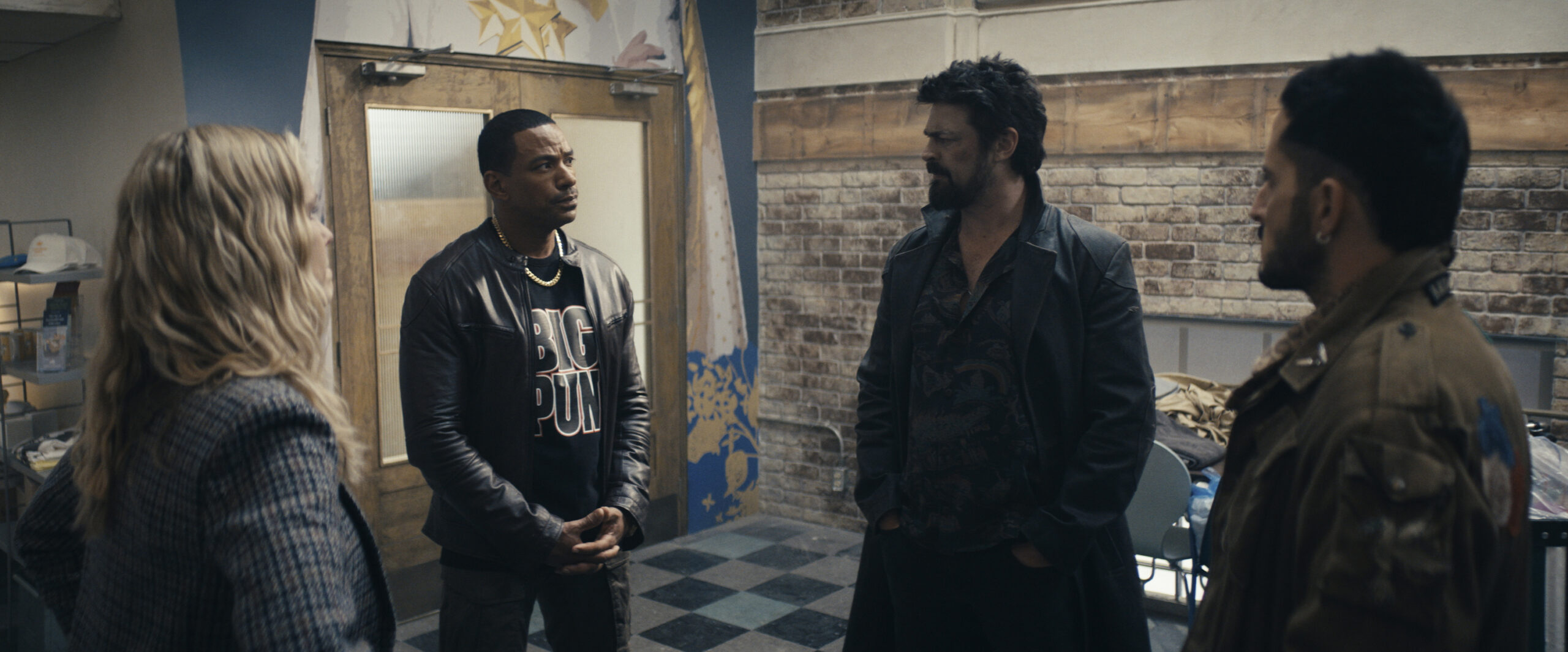 Still from The Boys Season 4 Episode 4, "Wisdom of the Ages," of Erin Moriarty as Annie January aka Starlight, Laz Alonso as Mother's Milk, Karl Urban as Billy Butcher, and Tomer Capone as Frenchie pictured left to right.