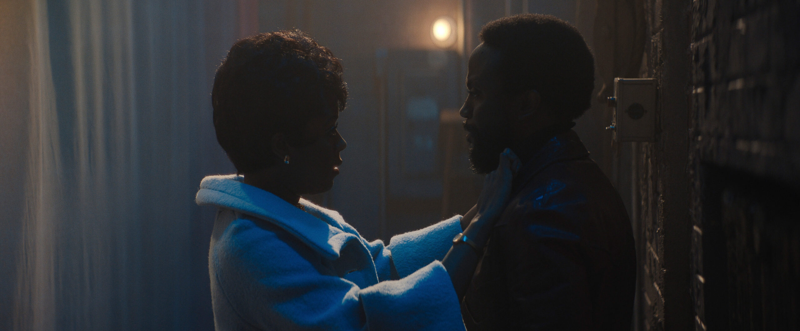 Still from Lady in the Lake Season 1 Episode 2 of Moses Ingram and Byron Bowers picture in side view and mostly in silhouette from left to right.