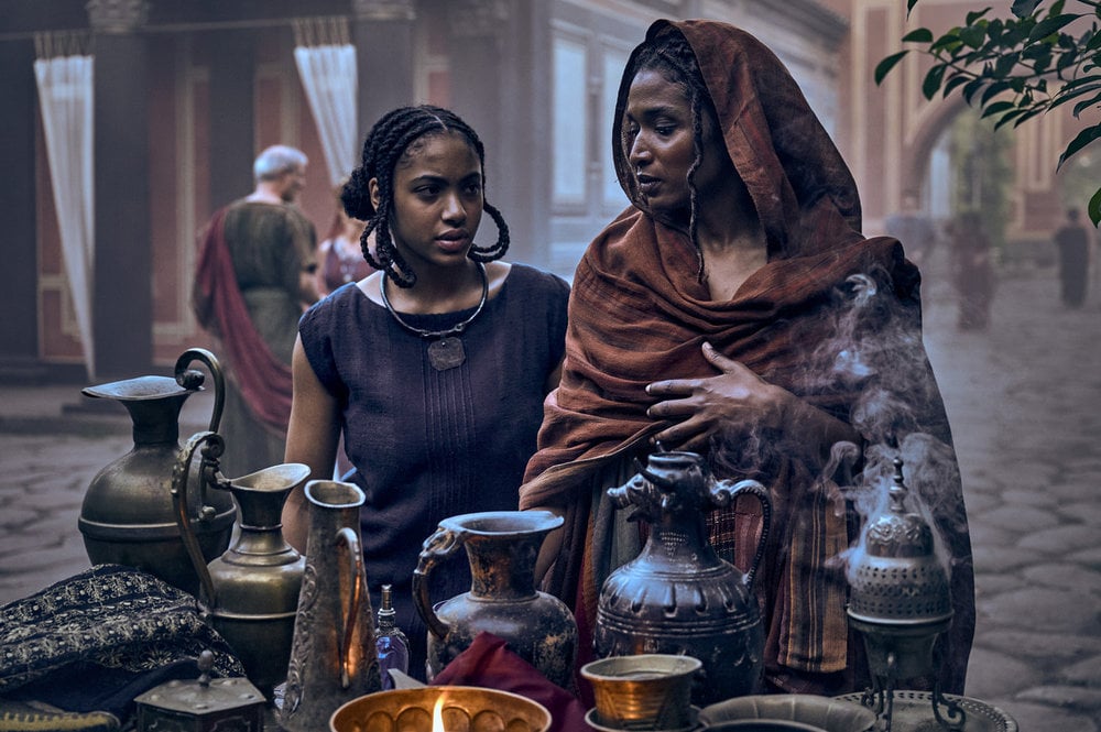 Still from Those About to Die Season 1 Episode 4 of Alicia Edogamhe as Jula and Sara Martins as Cala.