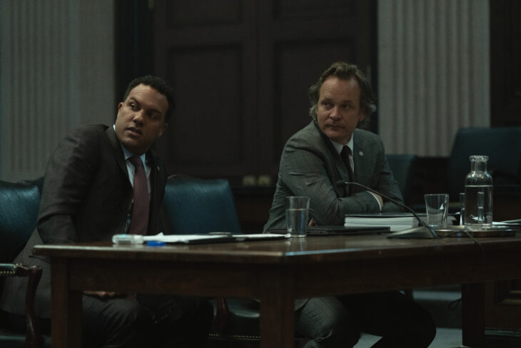 Nico and Tommy sitting at the prosecution table in court. Presumed Innocent Season 1 Episode 5 Review: Pregame 