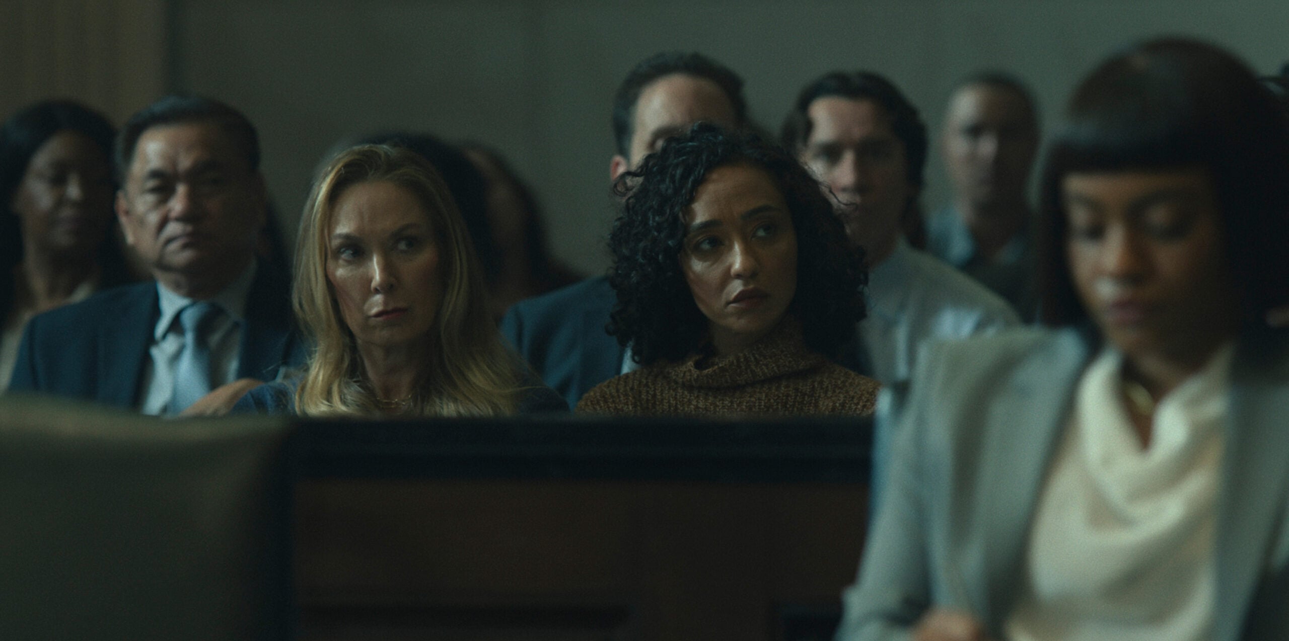 Elizabeth Marvel and Ruth Negga sitting in court.