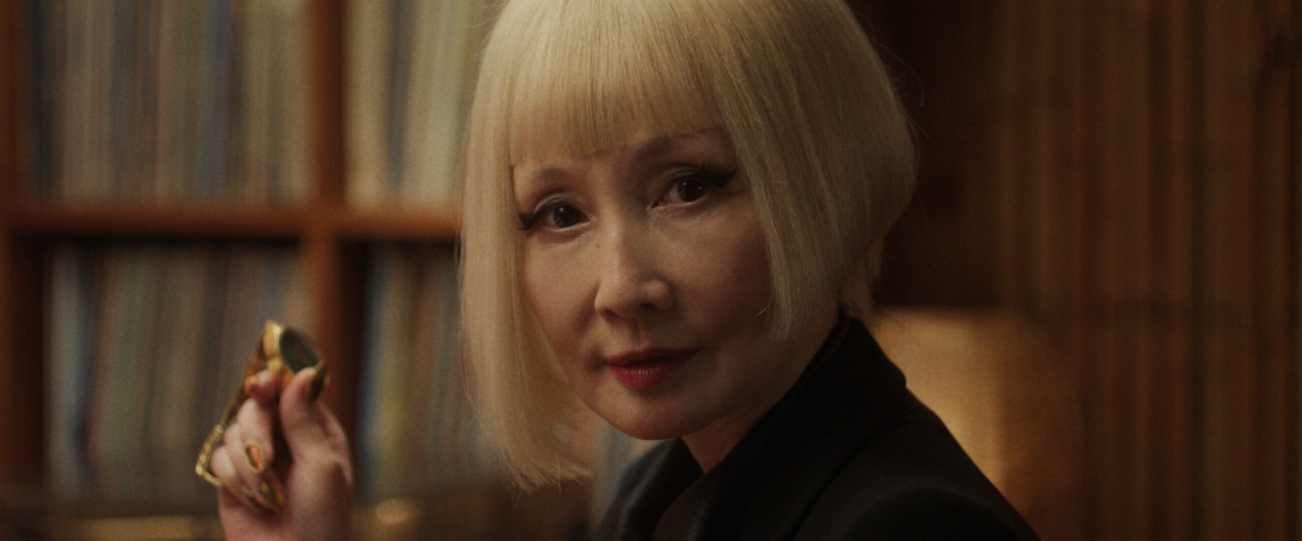 A closeup of Hime's face. She has a bleach-blonde bob with blunt bangs and intently looks at something off-screen on Sunny Season 1 Episode 4, "Sticky."