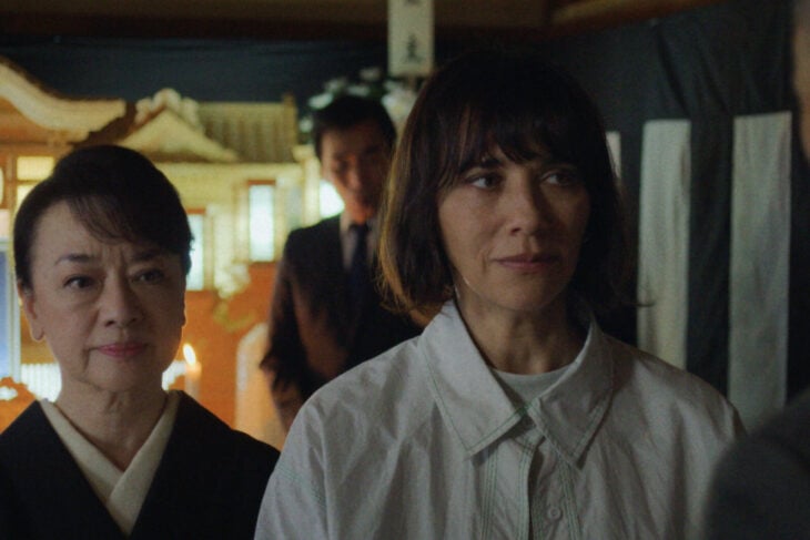 Suzie and Noriko talk to someone in a family shrine on Sunny Season 1 Episode 4, "Sticky."