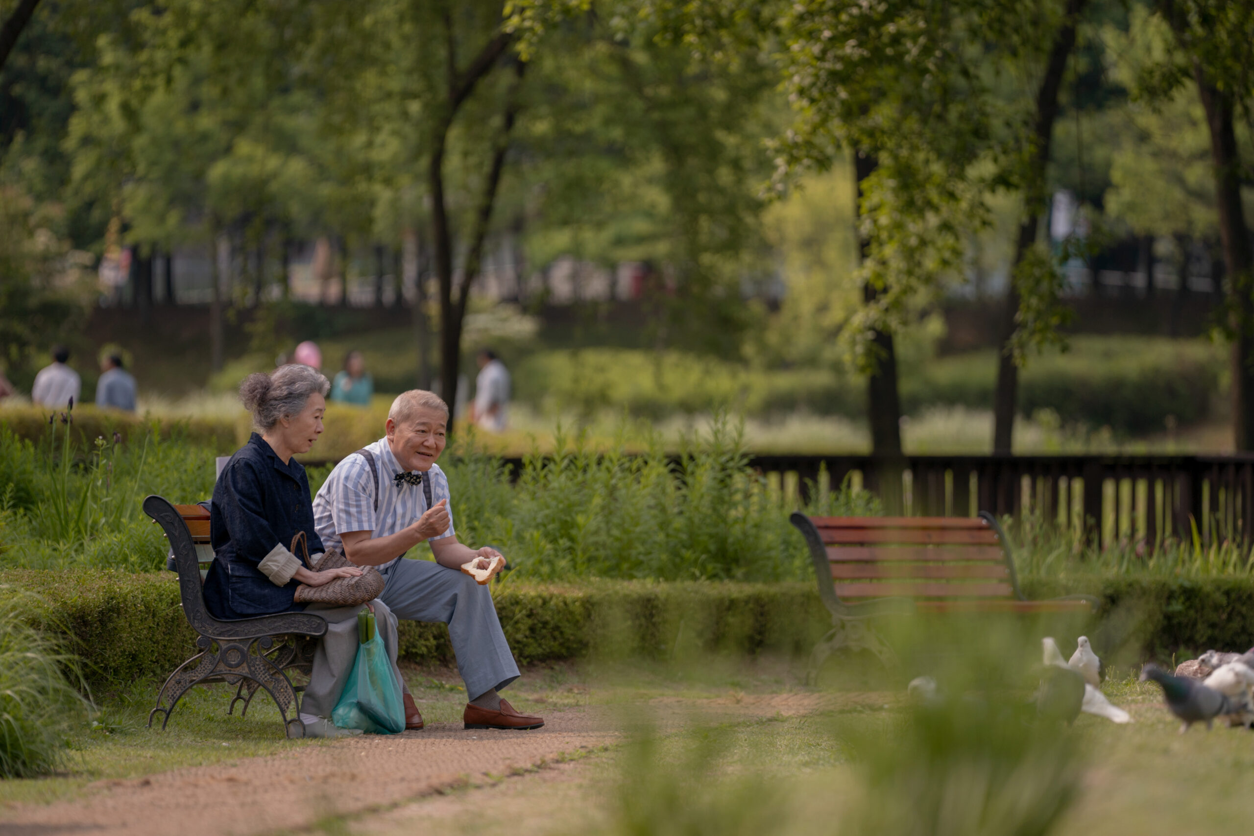 Still from Pachinko Season 2 Episode 3 of Yuh-Jung Youn and Jun Kunimura pictured from left to right.