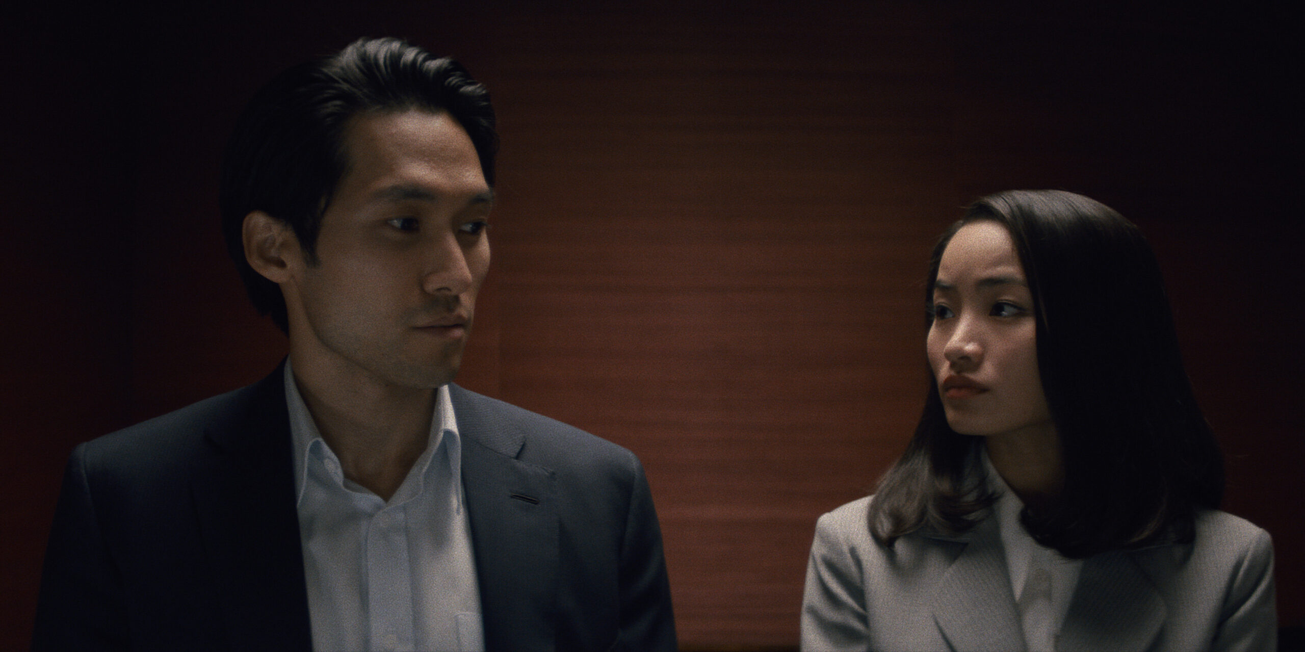 Still from Pachinko Season 2 Episode 3 of Jin Ha and Anna Sawai pictured from left to right.