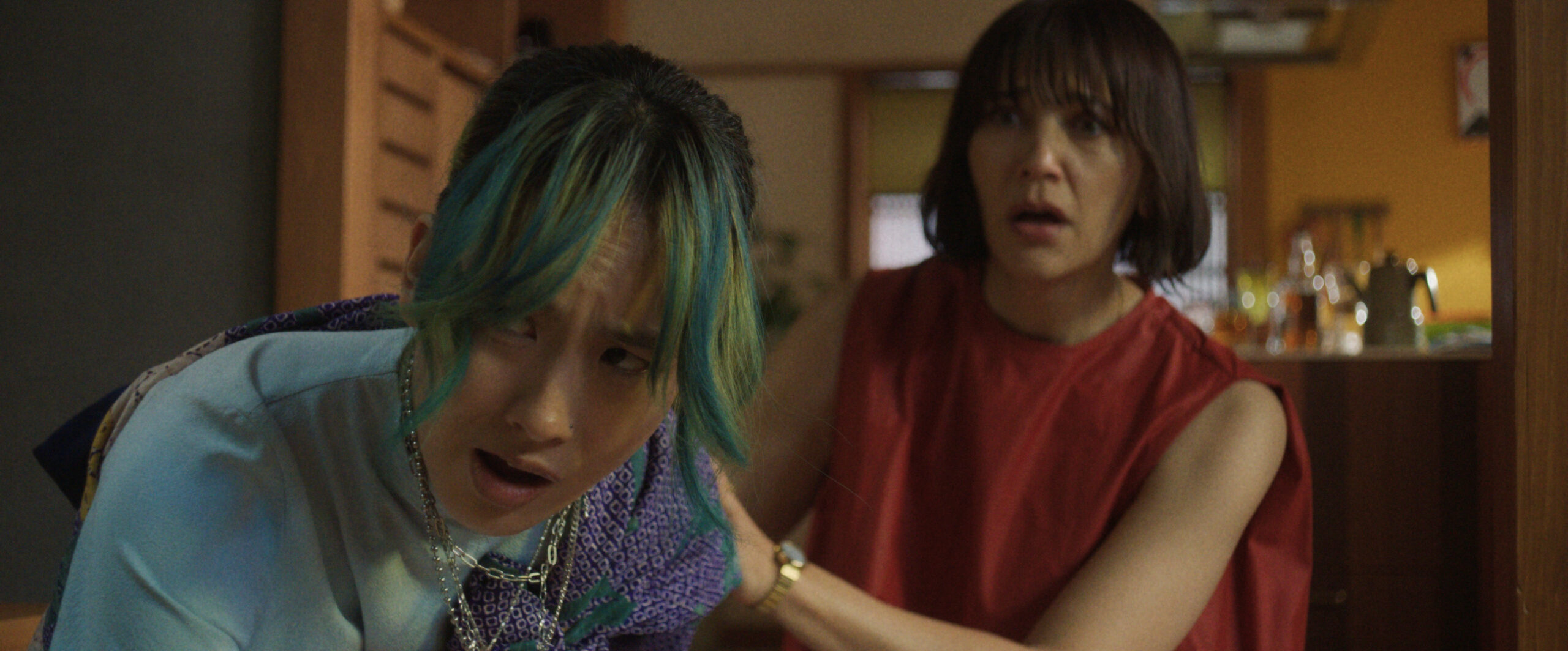 Mixxy leans over in pain and looks off-screen while Suzie stands behind her, in shock, on Sunny Season 1 Episode 7, "There's Been a Shift."
