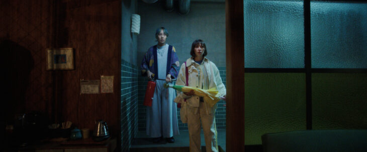 Mixxy and Suzie stand in the doorway of a laundry room while looking shocked on Sunny Season 1 Episode 7, "There's Been a Shift."