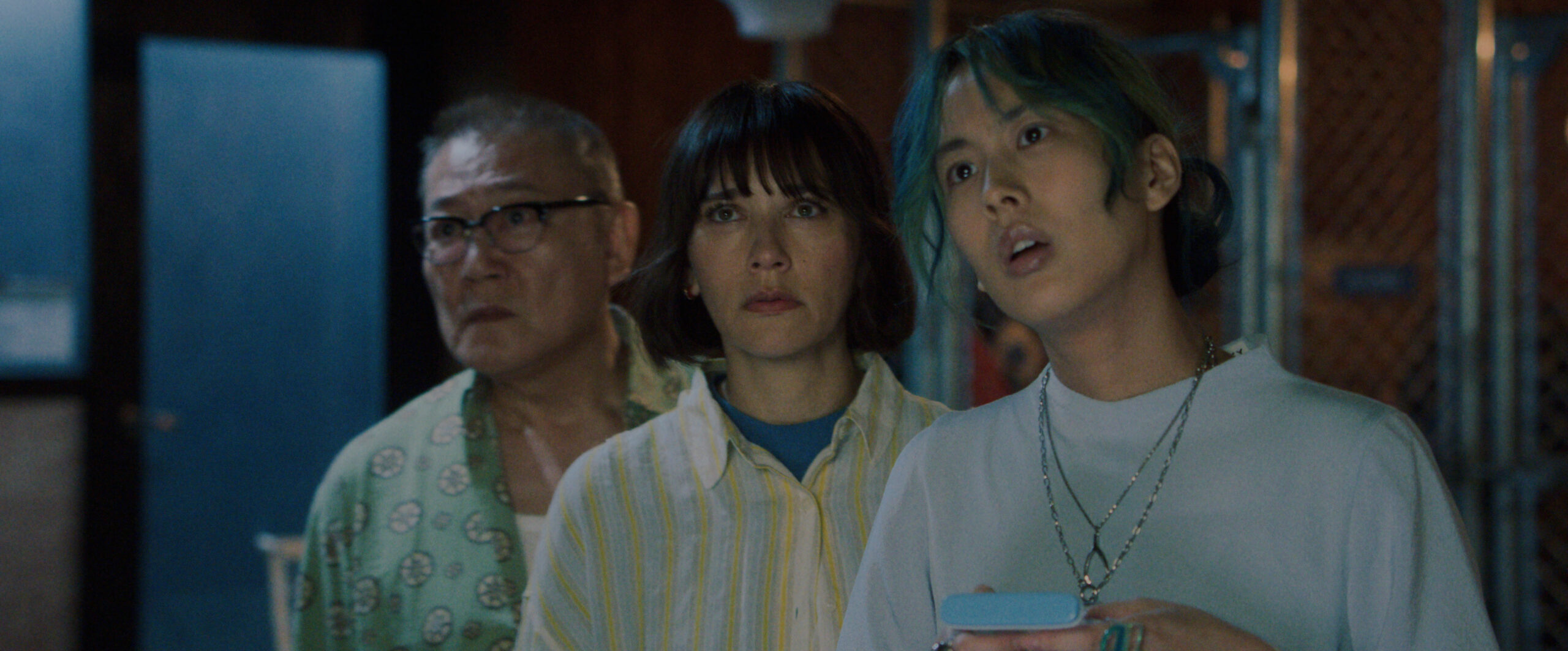 Sunny Season 1 Episode 8 Trash or Not-Trash | Tell-Tale TV Yuki Tanaka, Suzie, and Mixxy stand in a laundry room of an apartment complex while looking at something off-screen on Sunny Season 1 Episode 8, "Trash or Not-Trash."
