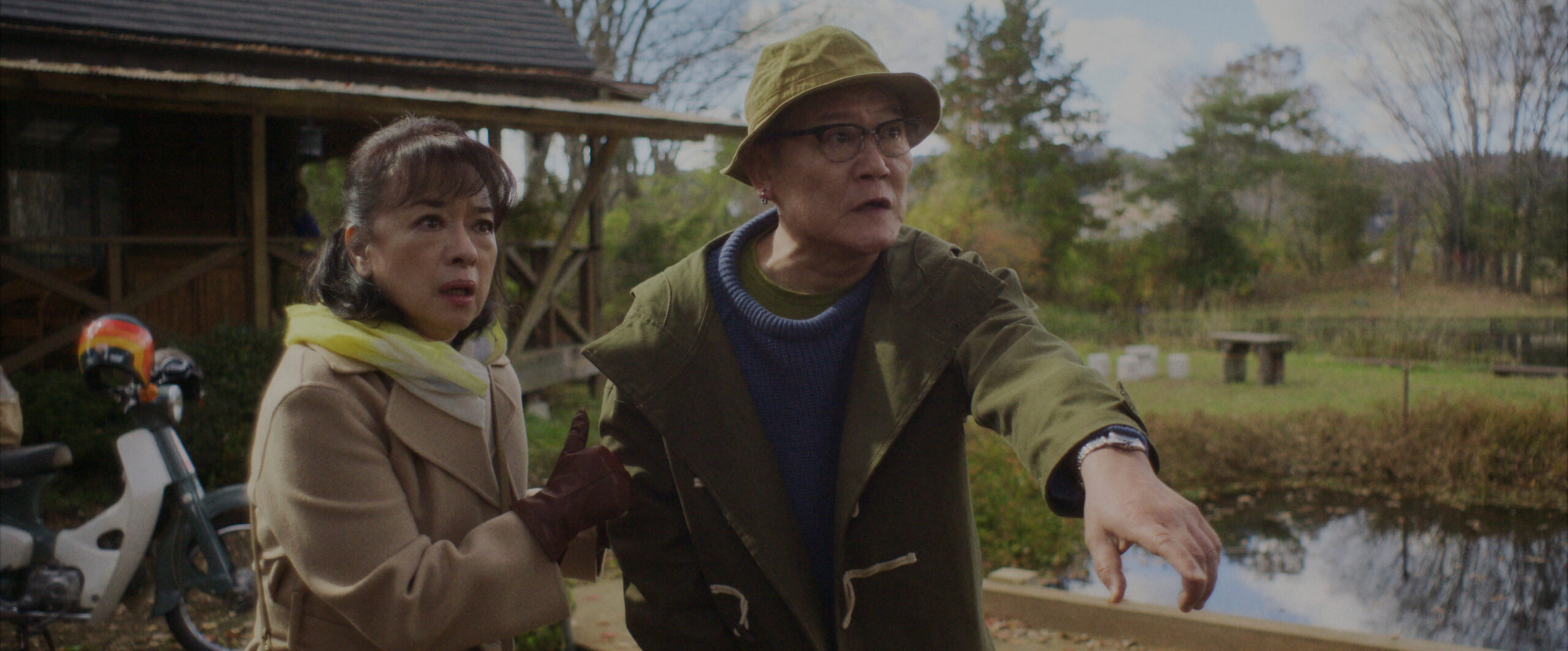 Sunny Season 1 Episode 8 Trash or Not-Trash | Tell-Tale TV Noriko and Yuki Tanaka stand outside a cabin in the countryside while looking at something off-screen in shock on Sunny Season 1 Episode 8, "Trash or Not-Trash."