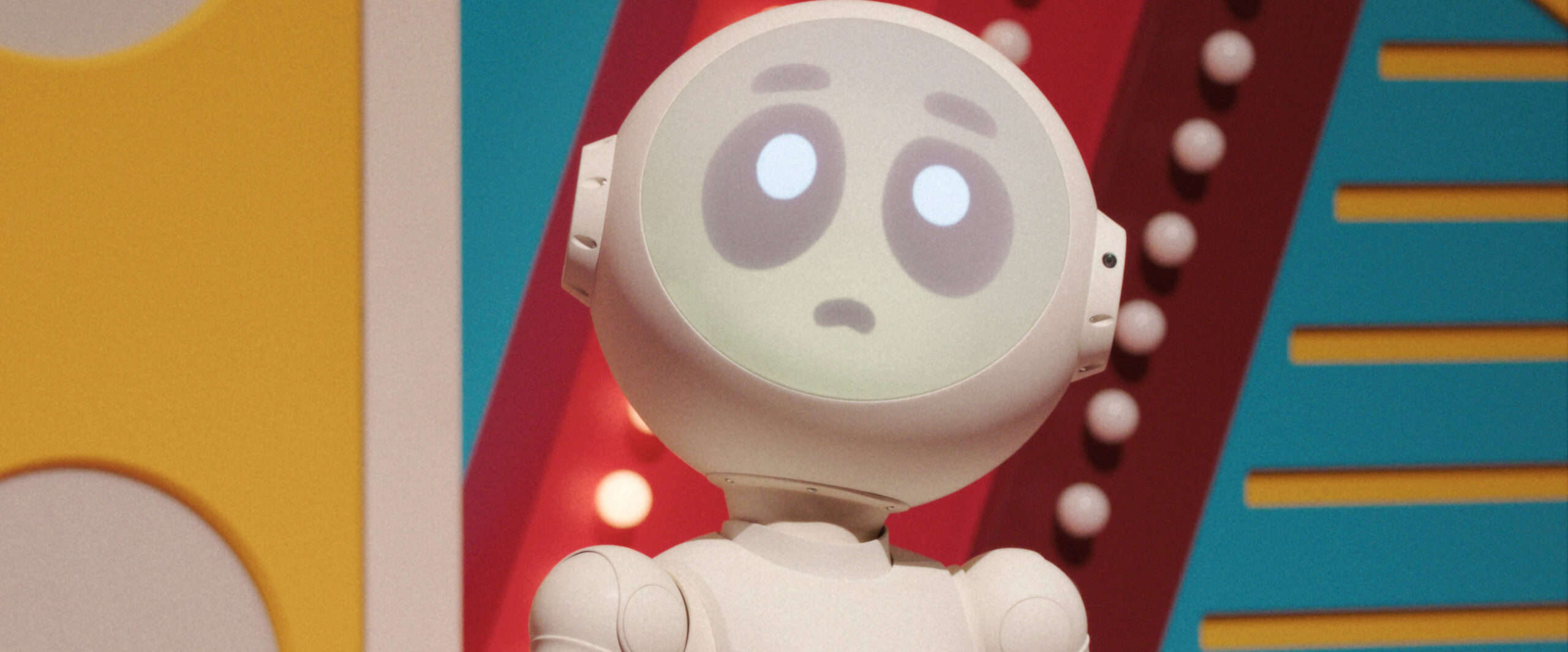 Sunny, white robot, stands on a Japanese gameshow stage while looking confused on Sunny Season 1 Episode 9, "Who's in the Box?"