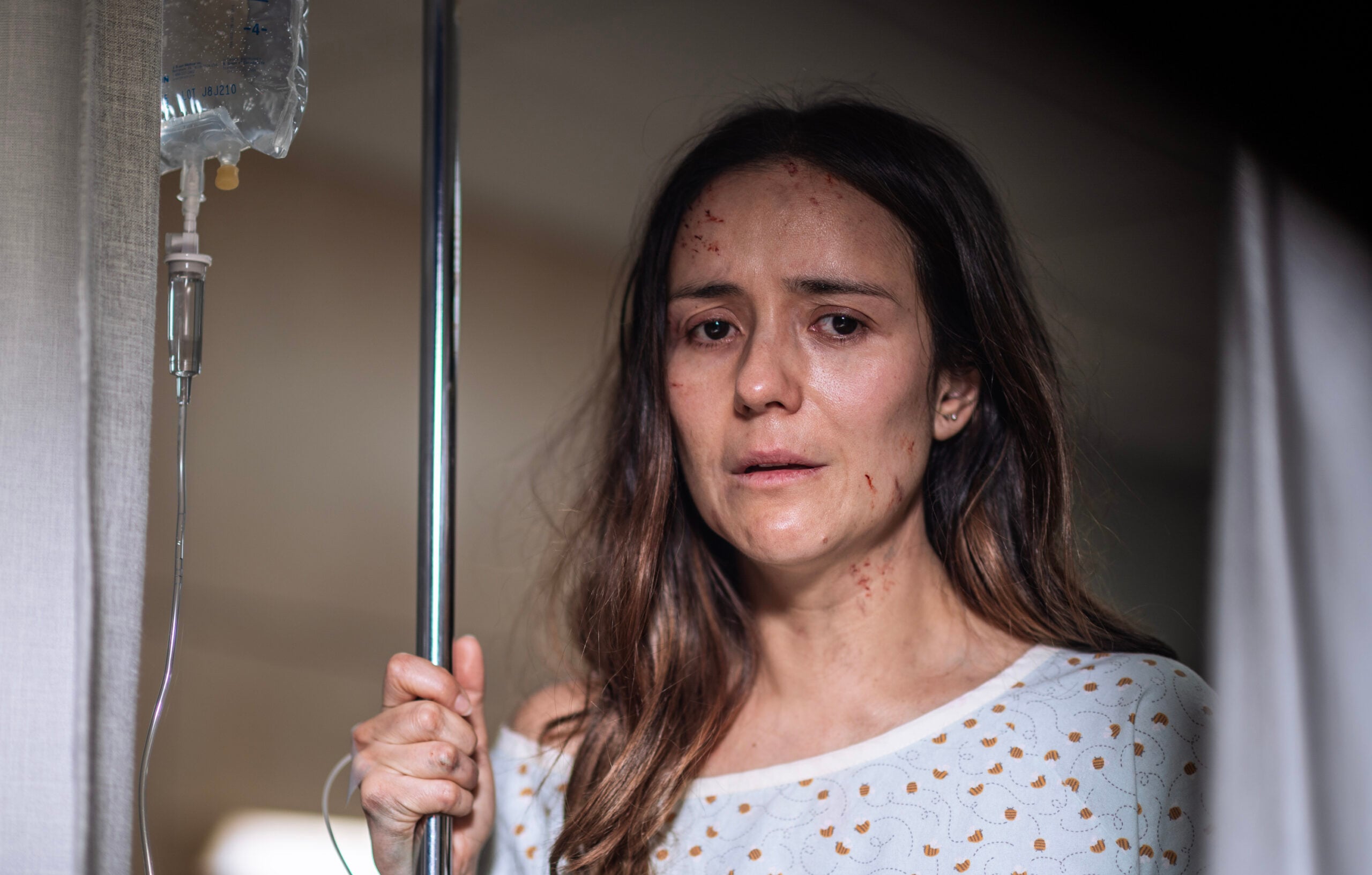 FROM Season 3 Episode 1, "Shatter." | Catalina Sandino Moreno in a hospital gown, staring out the window