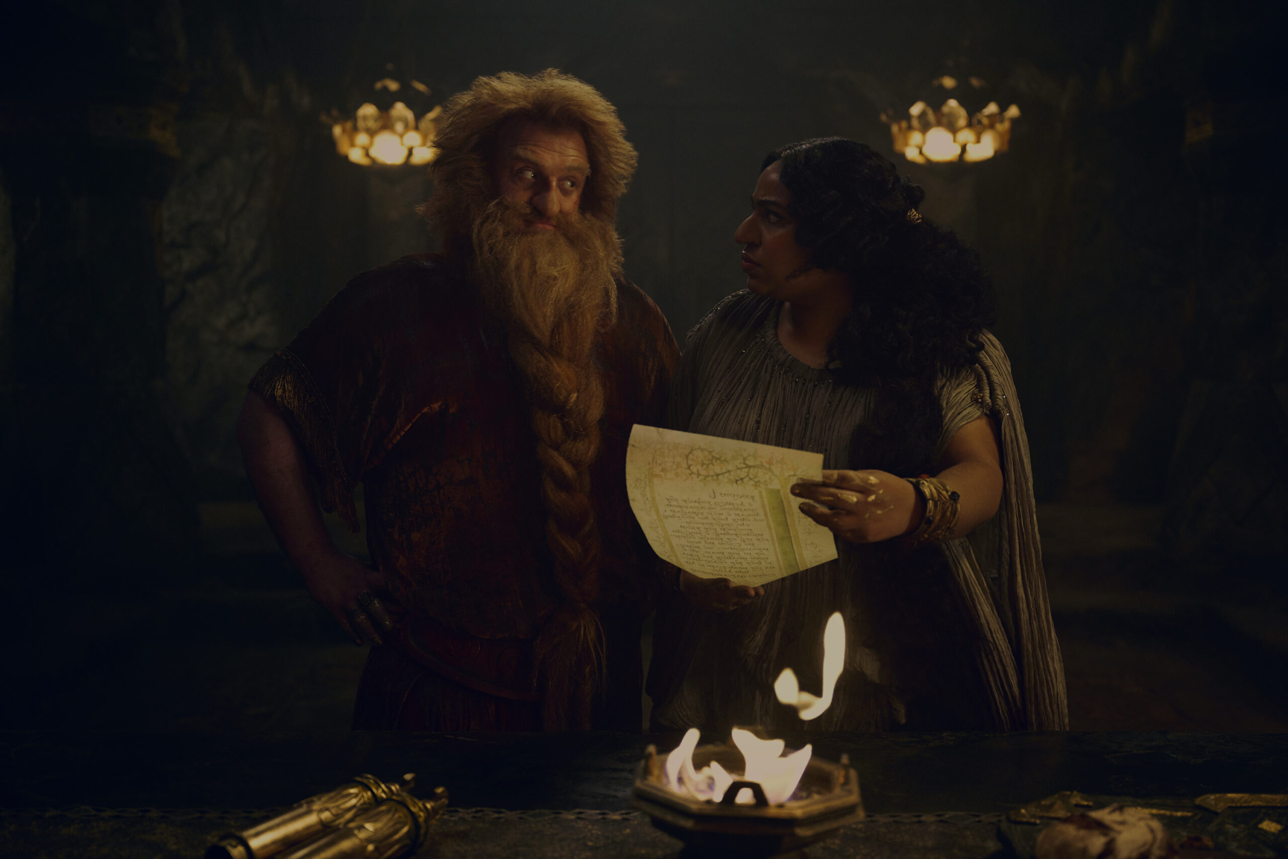Still from The Lord of the Rings: The Rings of Power Season 2 of Owain Arthur as Prince Durin IV and Sophia Nomvete as Disa pictured from left to right.
