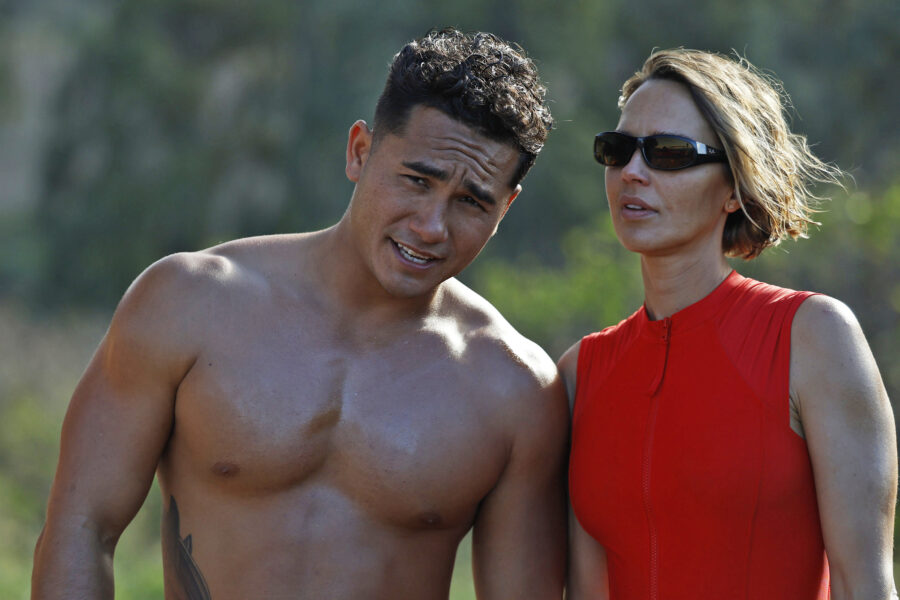RESCUE: HIGH SURF Season 1 Episode 3 - Kekoa Kekumano and Arielle Kebbel | Tell-Tale TV Still from RESCUE: HIGH SURF Season 1 Episode 3 of Kekoa Kekumano and Arielle Kebbel pictured from left to right.