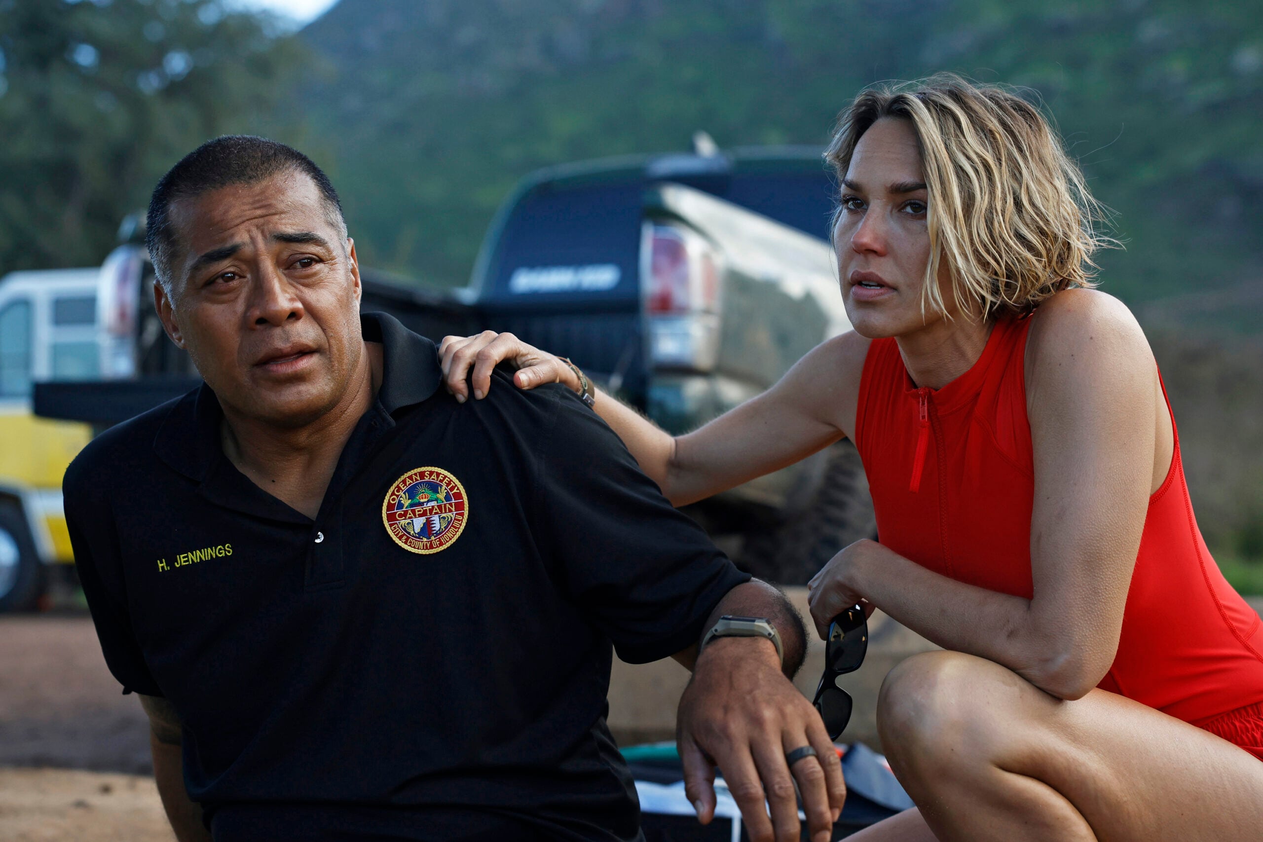 Still from RESCUE: HIGH SURF Season 1 Episode 3 of Robbie Magasiva and Arielle Kebbel pictured from left to right.