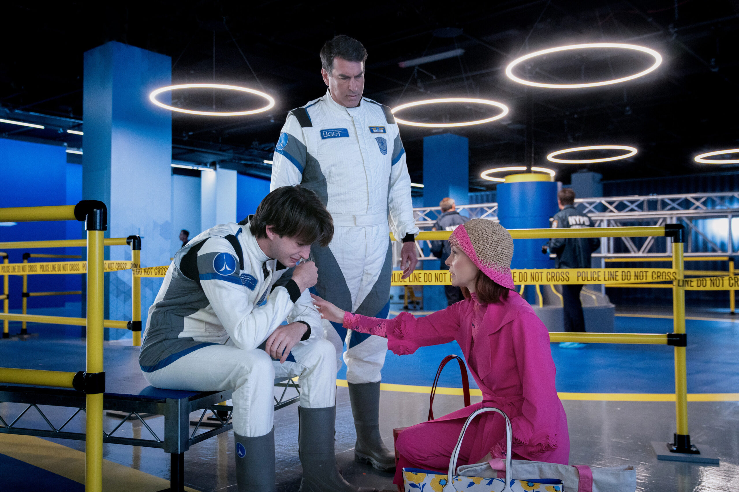 Still from Elsbeth Season 2 Episode 2 of Kedrik Merwin Jr. as Randy Dorsey, Rob Riggle as Neal Dorsey, and Carrie Preston as Elsbeth Tascioni pictured from left to right.