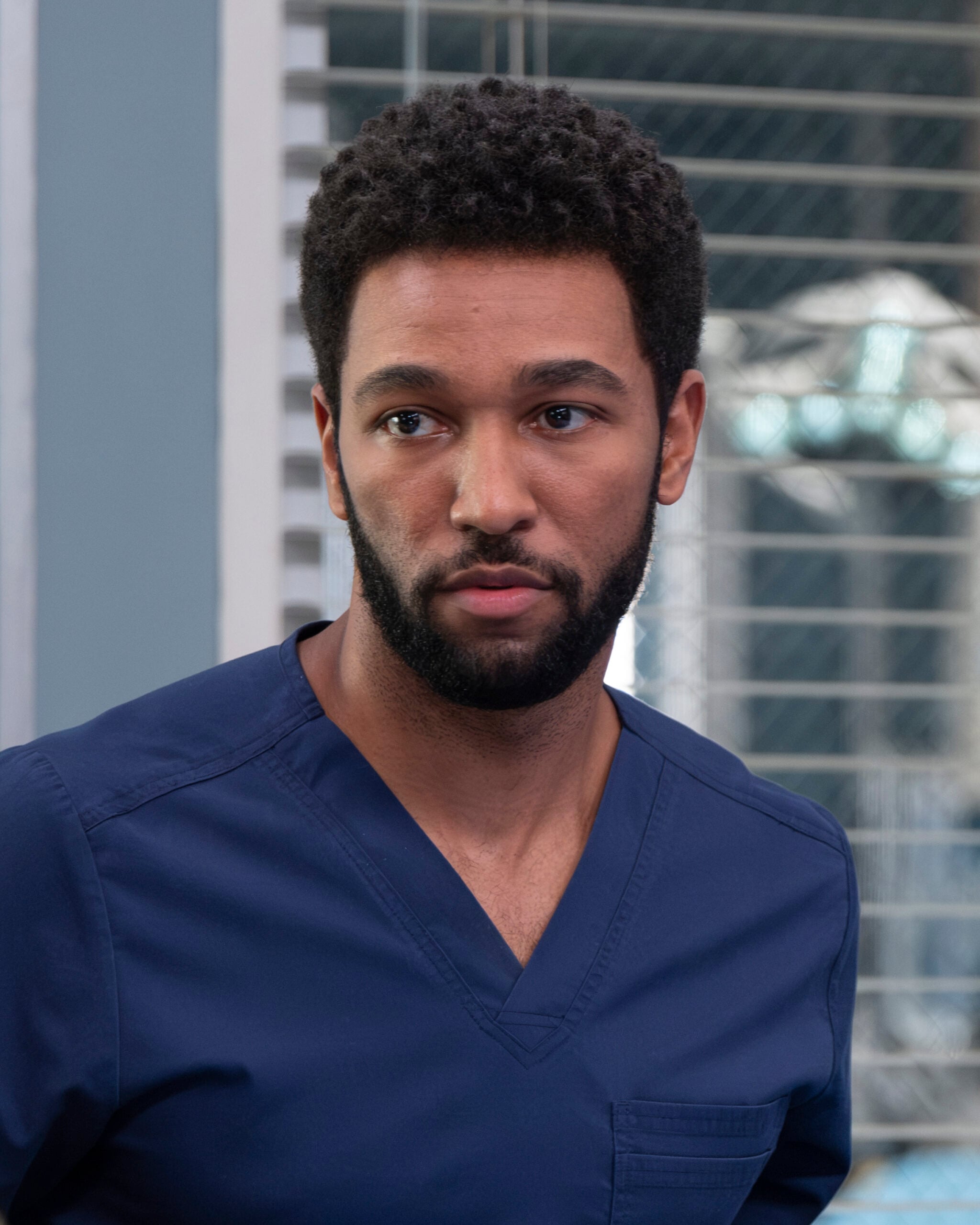 Grey's Anatomy Season 21 Episode 7, "If You Leave." ANTHONY HILL as Winston, looking sad in scrubs
