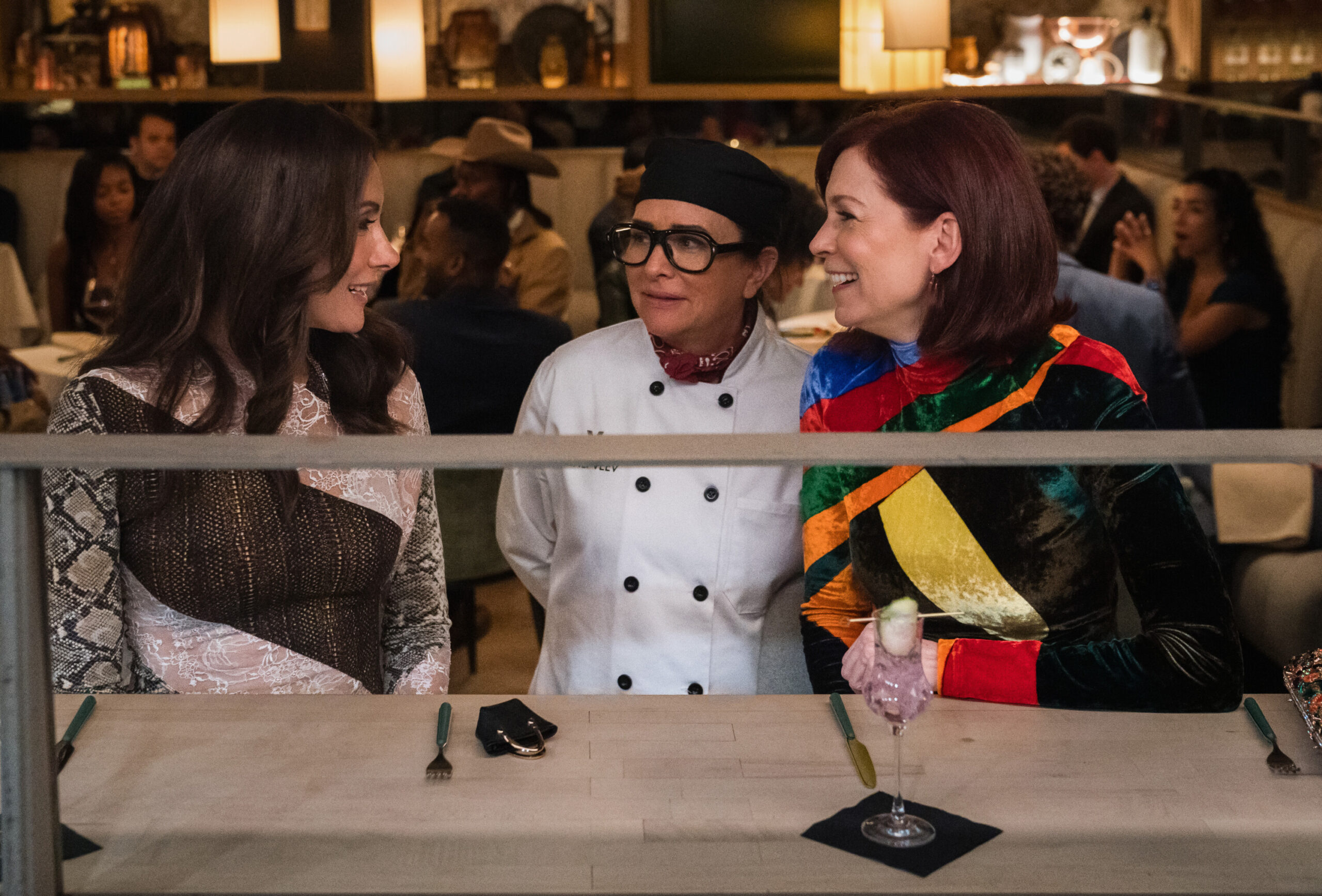 Still from Elsbeth Season 2 Episode 5 of Lauren Benanti as Nadine Clay, Pamela Adlon as Chef Z, and Carrie Preston as Elsbeth Tascioni pictured from left to right.