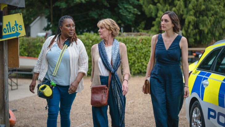 Still from THE MARLOW MURDER CLUB ON MASTERPIECE Season 1 Episode 3 of Jo Martin as Suzie Harris, Samantha Bond as Judith Potts, and Cara Horgan as Becks Starling.
