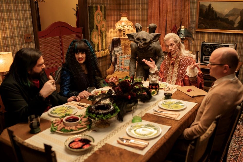 Laszlo, Nadja, Baron Afanas, Guillermo and Colin Robinson sit around the dining room table while The Sire serves them on What We Do in the Shadows Season 6 Episode 5, "Nandor's Army."
