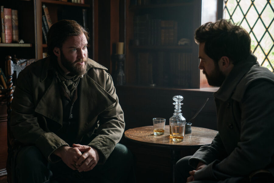 Outlander Season 7 Episode 15 — Richard Rankin as Roger MacKenzie and Diarmaid Murtagh as William "Buck" MacKenzie (Photo Courtesy of STARZ)