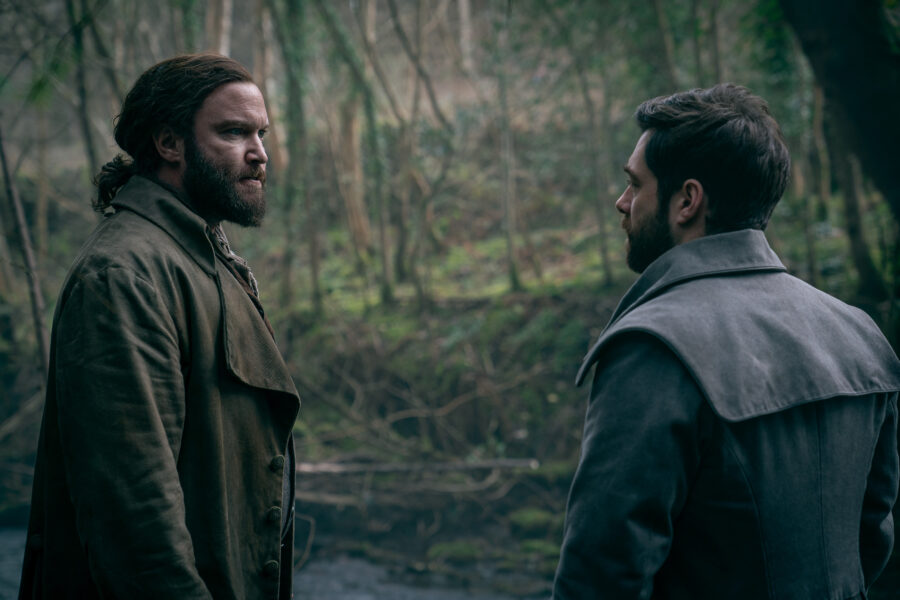 Outlander Season 7 Episode 15 — Richard Rankin as Roger MacKenzie and Diarmaid Murtagh as William "Buck" MacKenzie (Photo Courtesy of STARZ)