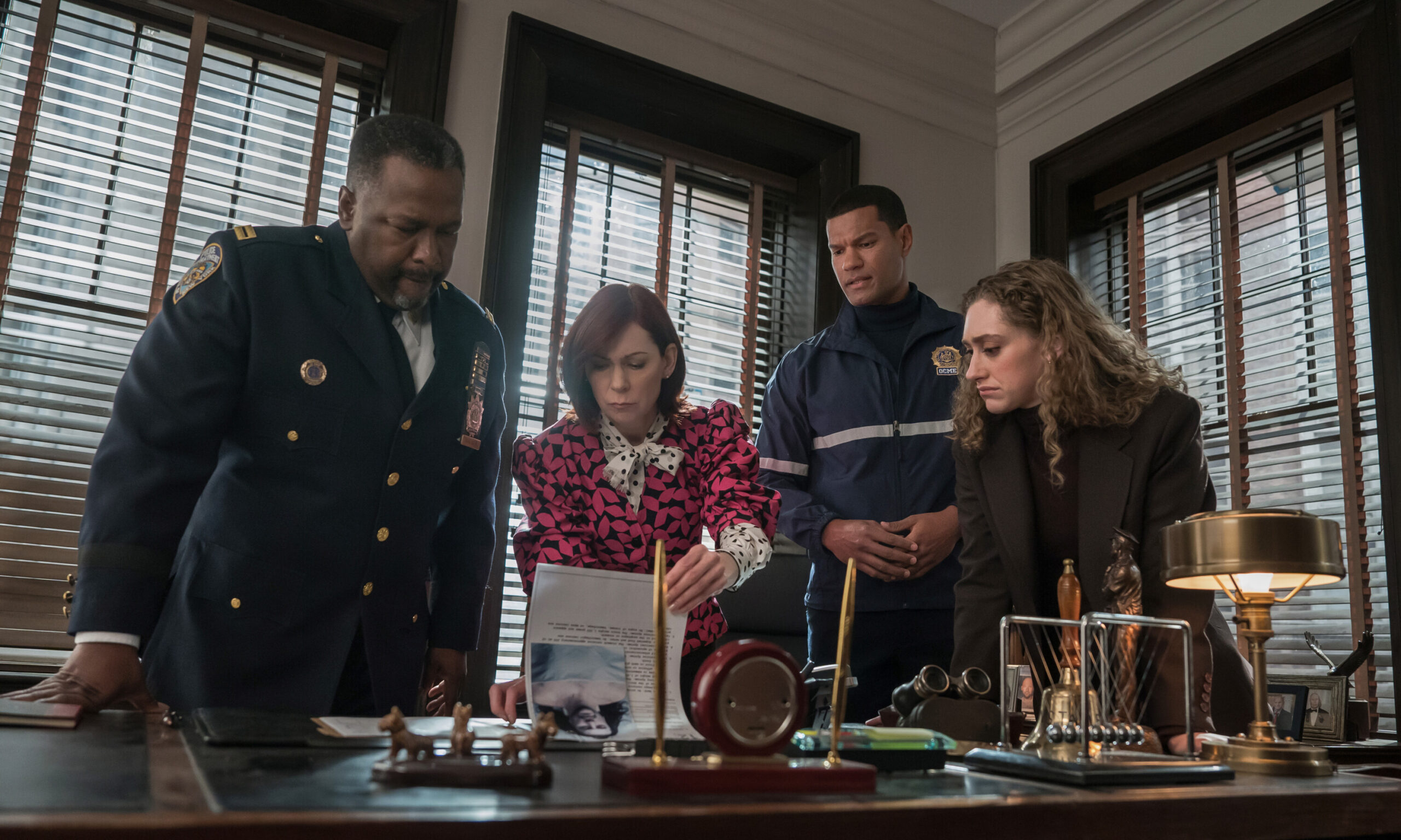 Still from Elsbeth Season 2 Episode 16 of Wendell Pierce as Captain Wagner, Carrie Preston as Elsbeth Tascioni, Sullivan Jones ass Cameron Clayden, and Micaela Diamond as Det. Samantha Edwards pictued from left to right.