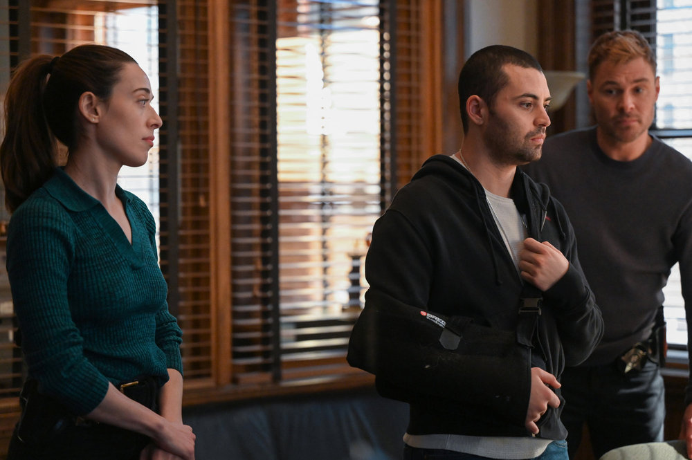 Chicago P.D. Season 12 Episode 20, "Black Ice" - (l-r) Marina Squerciati as Officer Kim Burgess, Benjamin Levy Aguilar as Dante Torres, and Patrick John Flueger as Officer Adam Ruzek