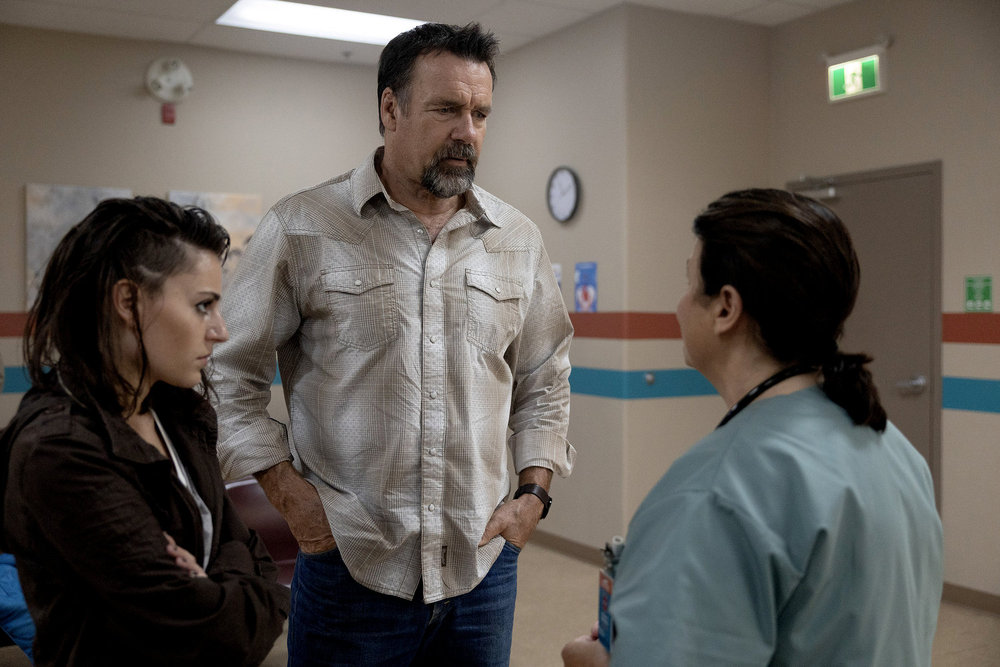 Revival Season 1 Episode 5 - Romy Weltman and David James Elliott | Tell-Tale TV Still from Revival Season 1 Episode 5 of Romy Weltman as Martha "Em" Cypress and David James Elliott as Sheriff Wayne Cypress pictured from left to right.