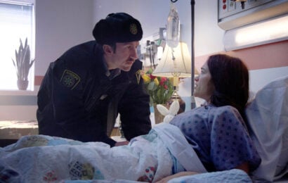 Still from Revival Season 1 Episode 6 of Mark Little as Deputy Brent and Melanie Scrofano as Dana Cypress pictured from left to right. Revival Season 1 Episode 6 Review: Bloodlines Still from Revival Season 1 Episode 6 of Mark Little as Deputy Brent and Melanie Scrofano as Dana Cypress pictured from left to right.