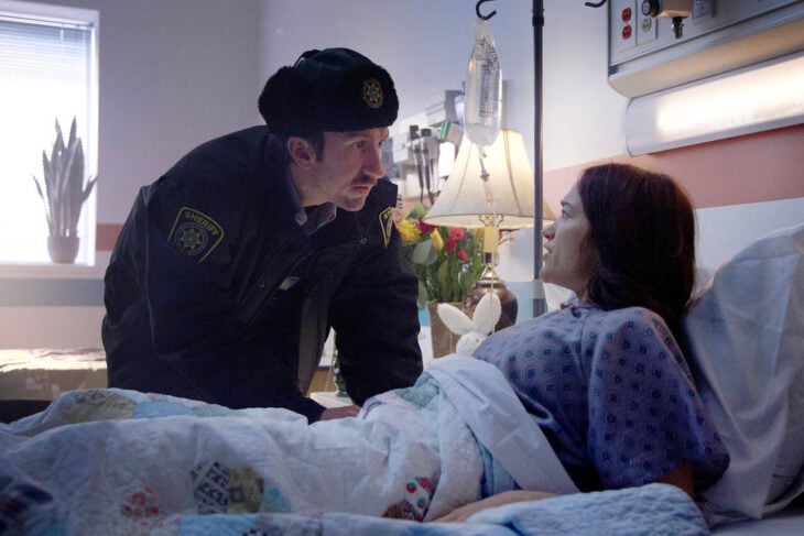 Still from Revival Season 1 Episode 6 of Mark Little as Deputy Brent and Melanie Scrofano as Dana Cypress pictured from left to right. Revival Season 1 Episode 6 Review: Bloodlines Still from Revival Season 1 Episode 6 of Mark Little as Deputy Brent and Melanie Scrofano as Dana Cypress pictured from left to right.