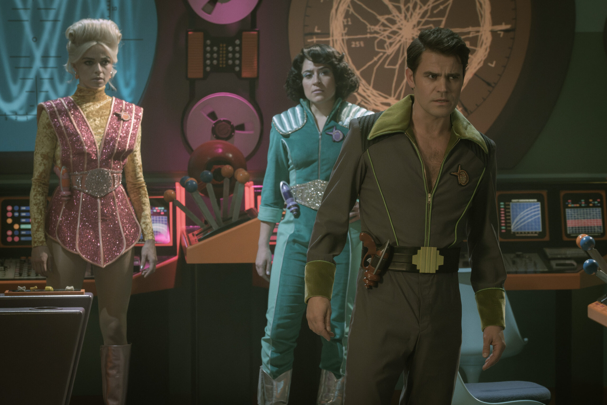 A Space Adventure Hour | Tell-Tale TV Jess Bush as Chapel, Melissa Navia as Ortegas, and Paul Wesley as Kirk on Star Trek: Strange New Worlds Season 3 Episode 4, "A Space Adventure Hour."