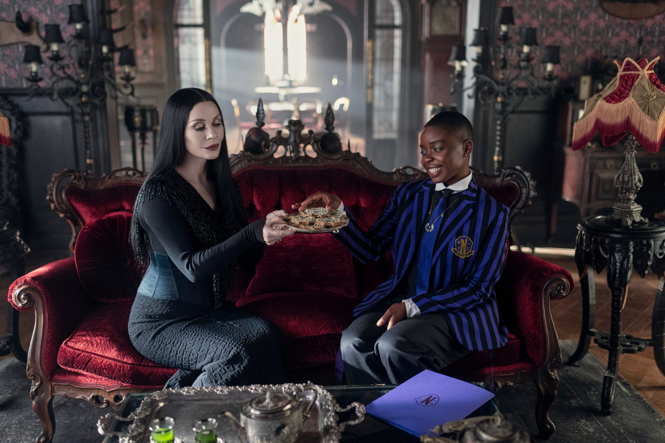 Wednesday Season 2 Episode 2 | Tell-Tale TV Wednesday Season 2 Episode 2 -- Catherine Zeta-Jones as Morticia Addams, Joy Sunday as Bianca Barclay