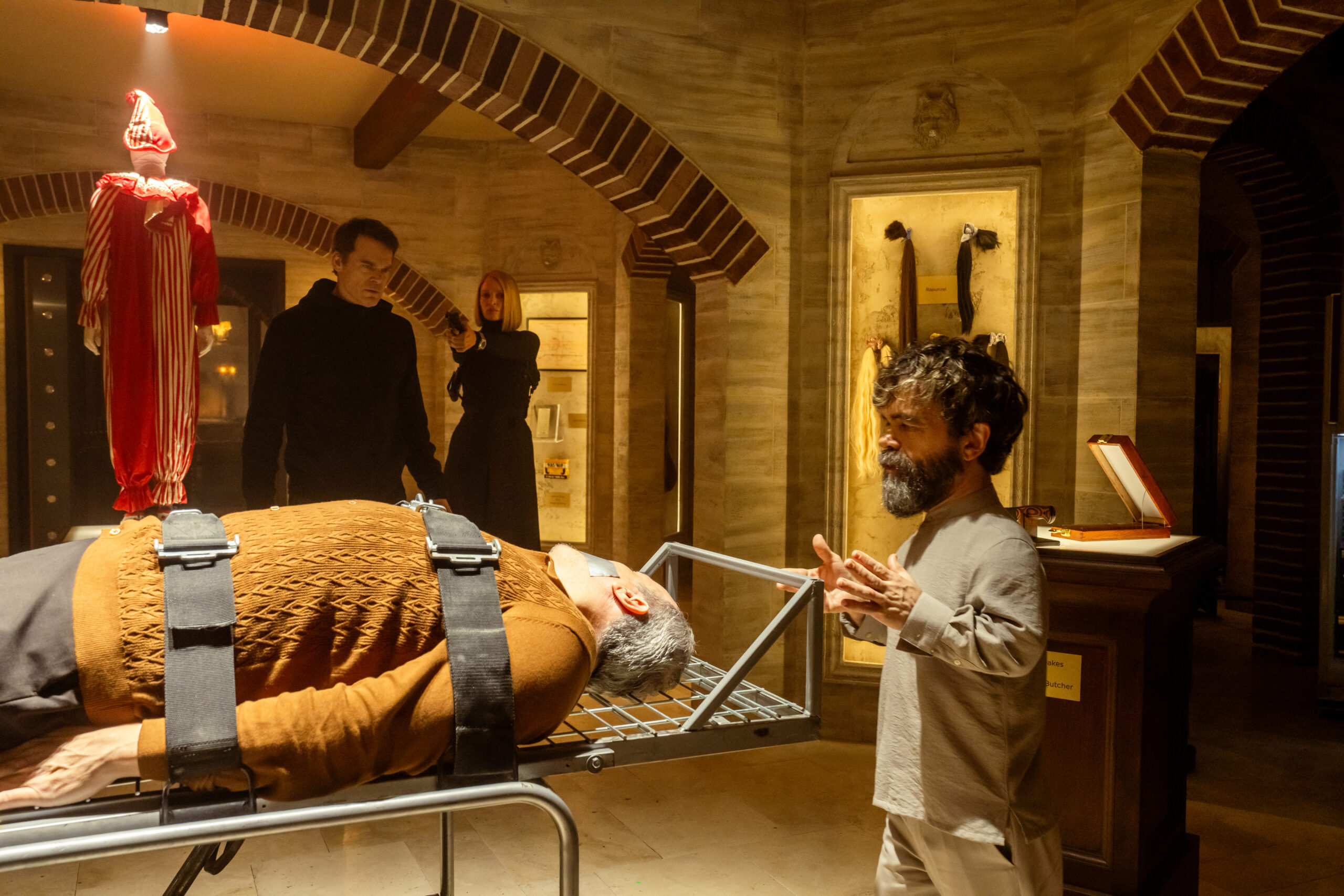 Dexter: Resurrection Season 1 Episode 9, "Touched By An Ángel" - (l-r) Michael C. Hall as Dexter Morgan, Uma Thurman as Charley, David Zayas as Angel Batista, and Peter Dinklage as Leon Prater