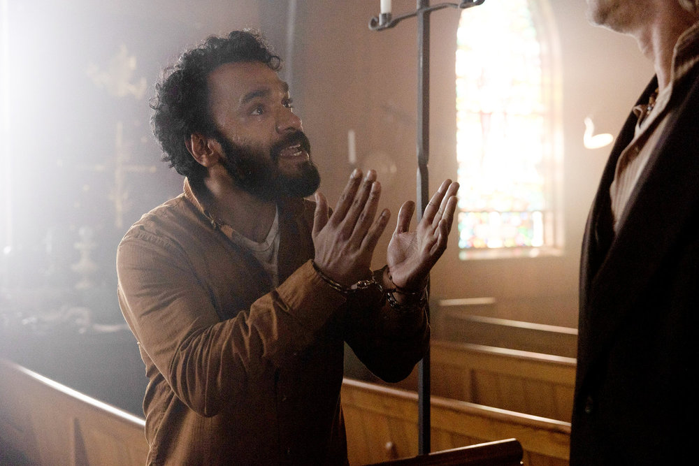 Still from Revival Season 1 Episode 10 of Andy McQueen as Ibrahim Ramin.