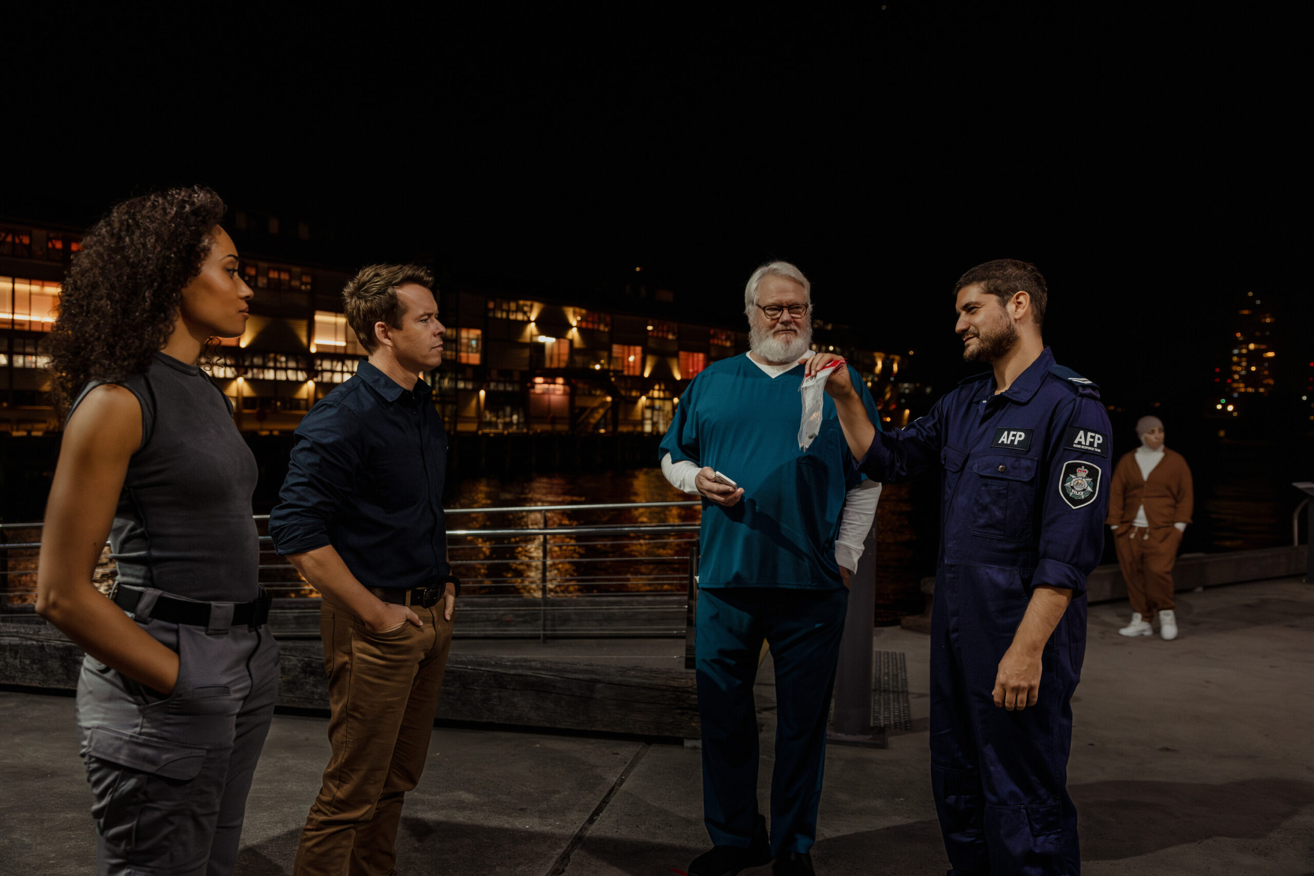 NCIS: Sydney Season 3 Episode 1, "Gut Instinct" -- Olivia Swann as NCIS Special Agent Captain Michelle Mackey, Todd Lasance as AFP Liaison Officer Sergeant Jim 'JD' Dempsey, William McInnes as Forensic Pathologist Dr. Roy Penrose and Claude Jabbour as Travis “Trigger” Riggs