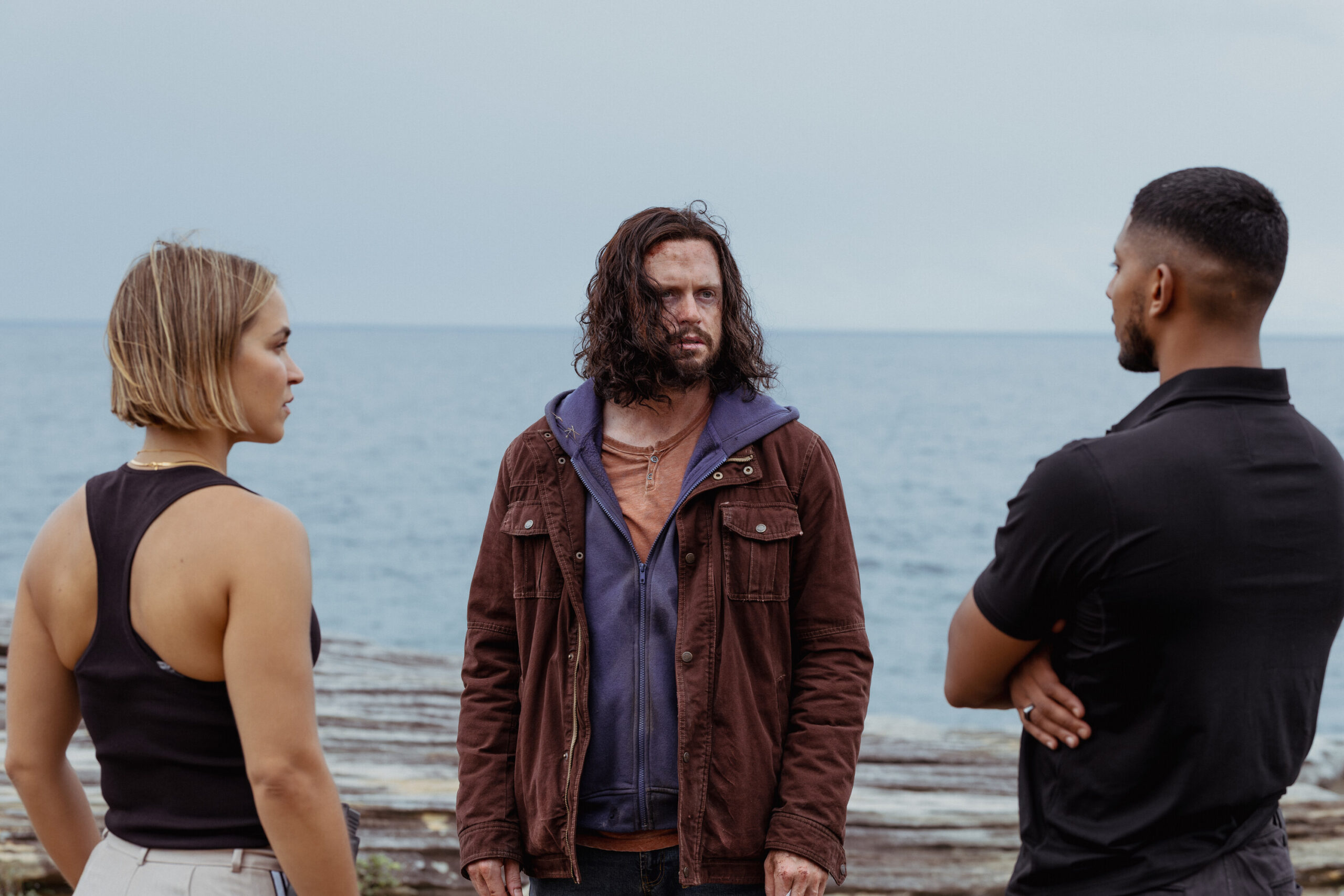 NCIS: Sydney Season 3, Episode 3, "Lost In Translation" -- Tuuli Narkle as AFP Liaison Officer Constable Evie Cooper, Hugo Johnstone-Burt as Sgt. Henry Ascott, and Sean Sagar as NCIS Special Agent DeShawn Jackson